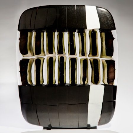 pictoral art glass sculpture in black and white on black metal stand