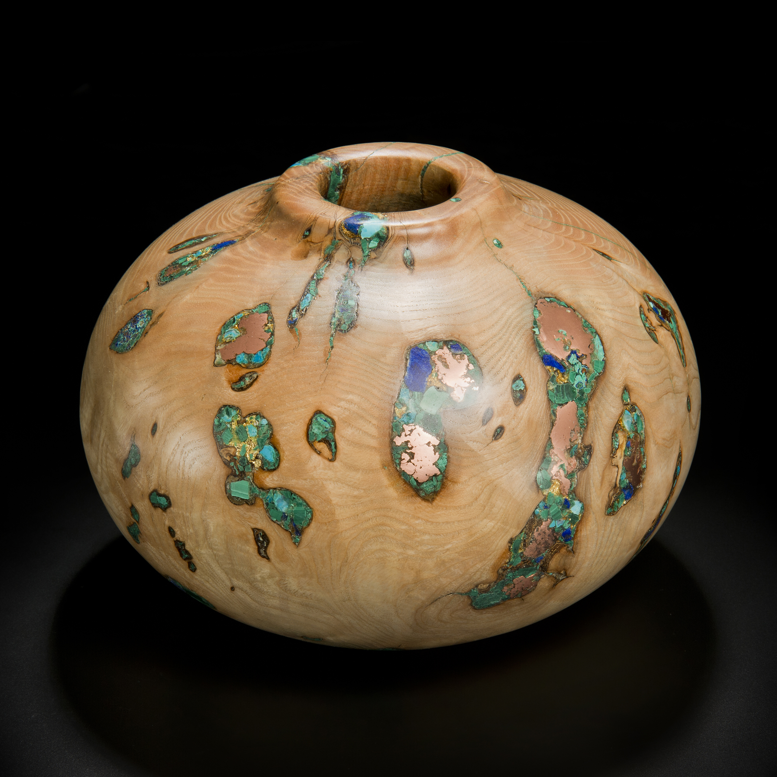 short sculpted vessel from natural looking ash wood and precious minerals in beige brown and speckled turquoise 