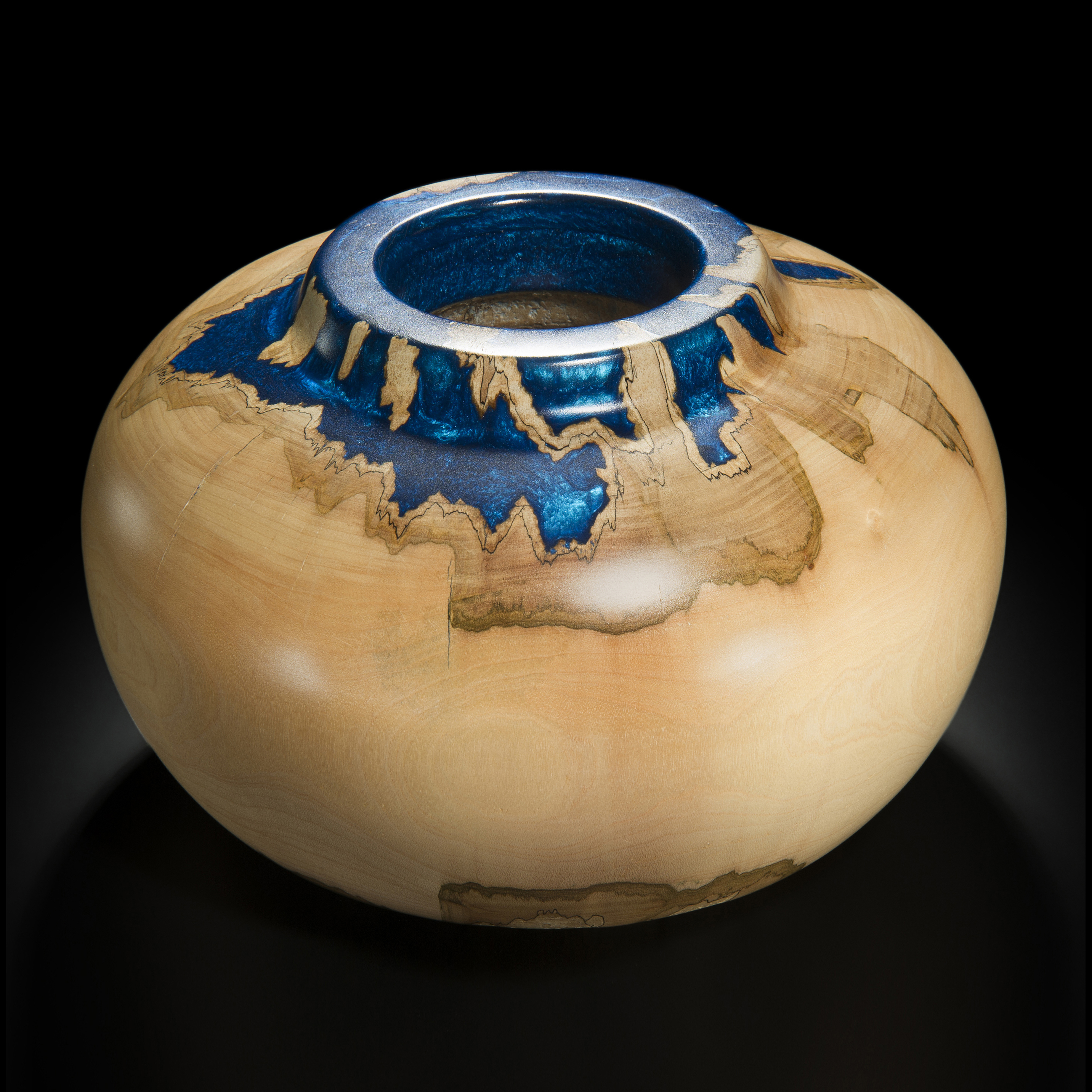 sculpted sycamore wood vessel with blue metal inlay