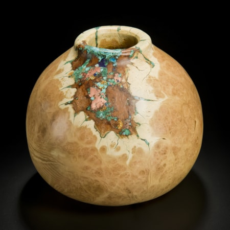 medium height sculpted acacia wood vessel with precious mineral inlay in natural looking browns and turquoise