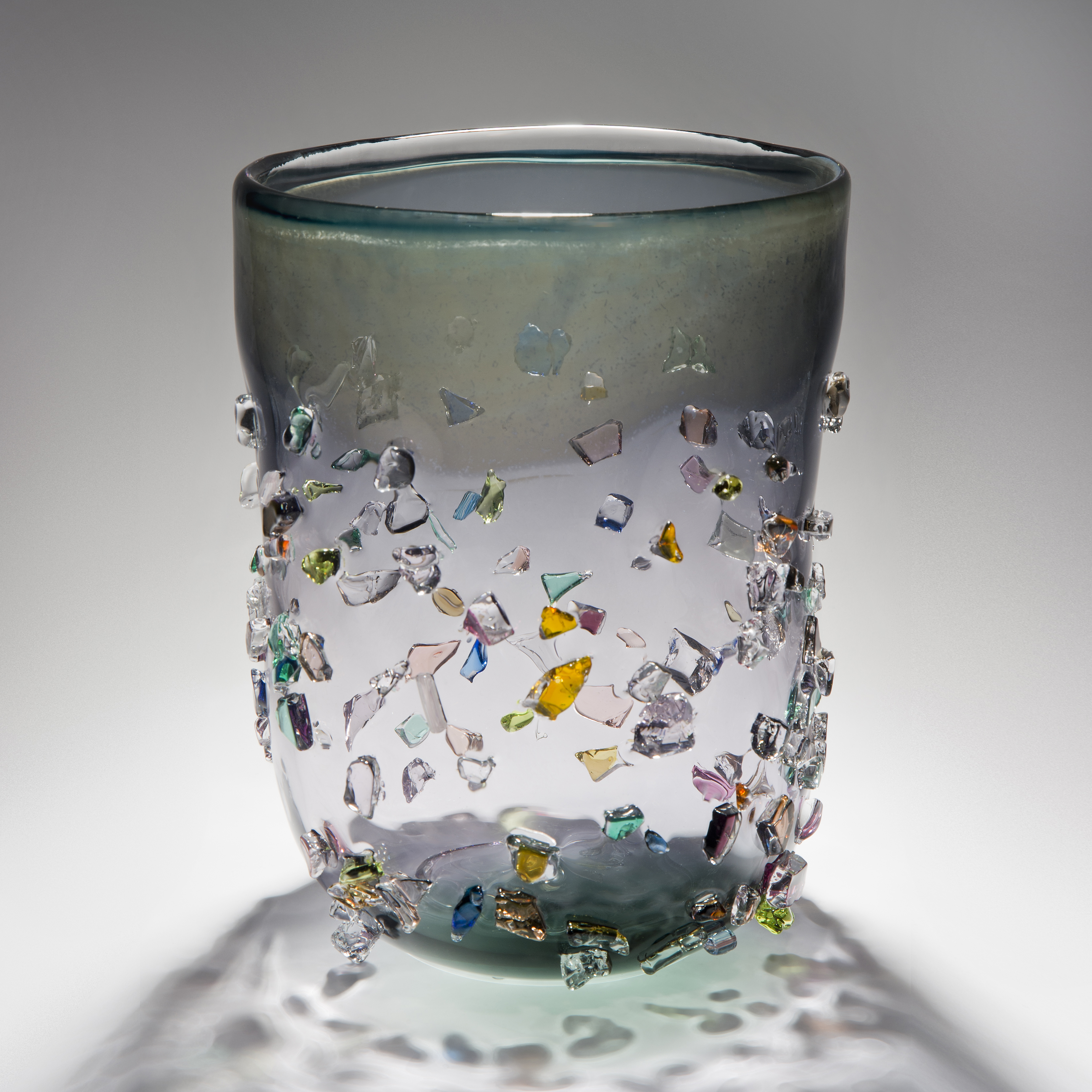 decorative glass vase sculpture in clear and light green and grey shades with external coloured crystals