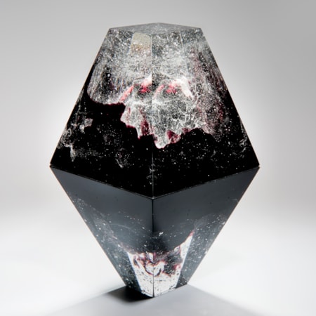 diamond shaped art-glass sculpture with plaster insert resembling frozen form in black crystal red