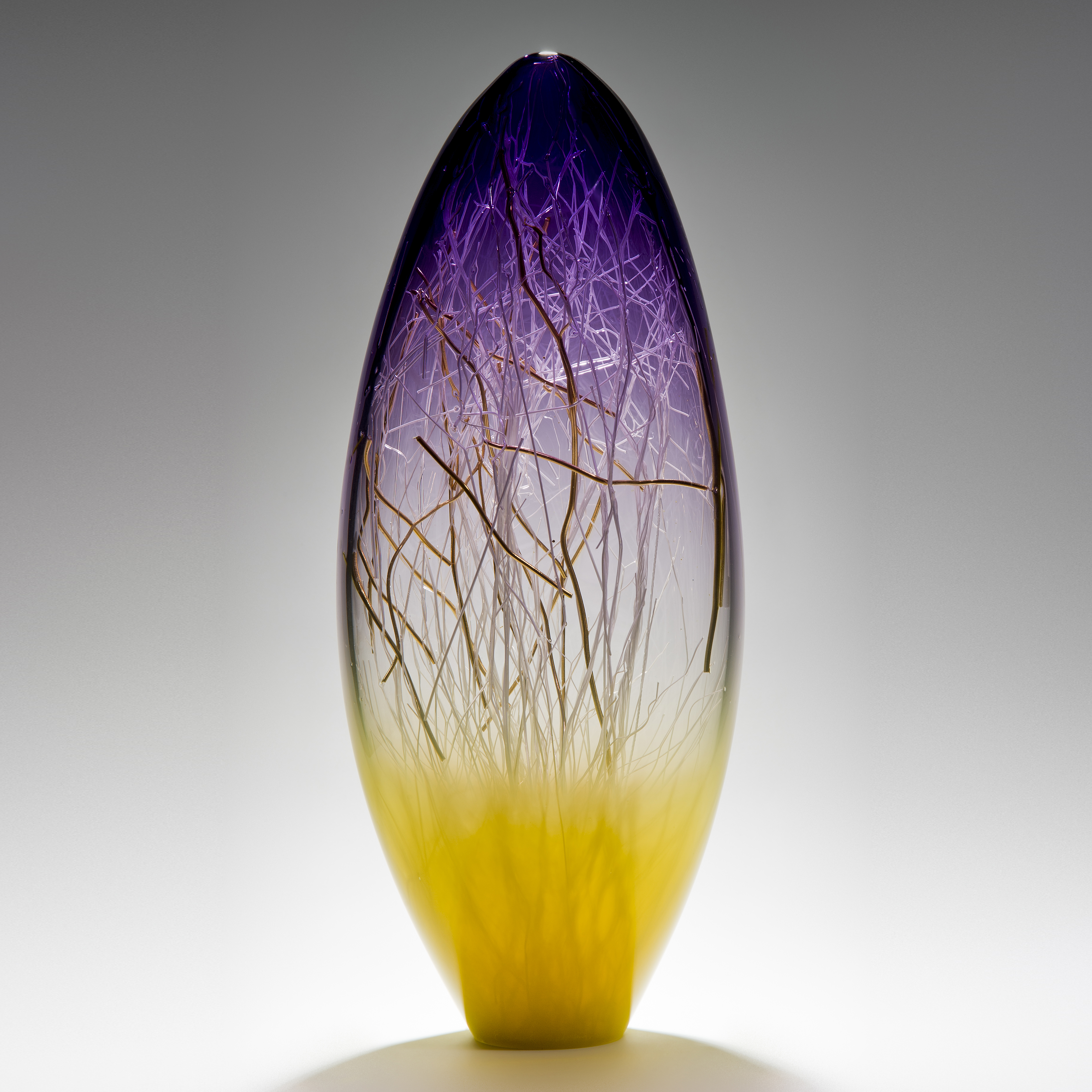 tall curved hyacinth and primrose coloured glass sculpture with delicate nature-inspired internal structure 