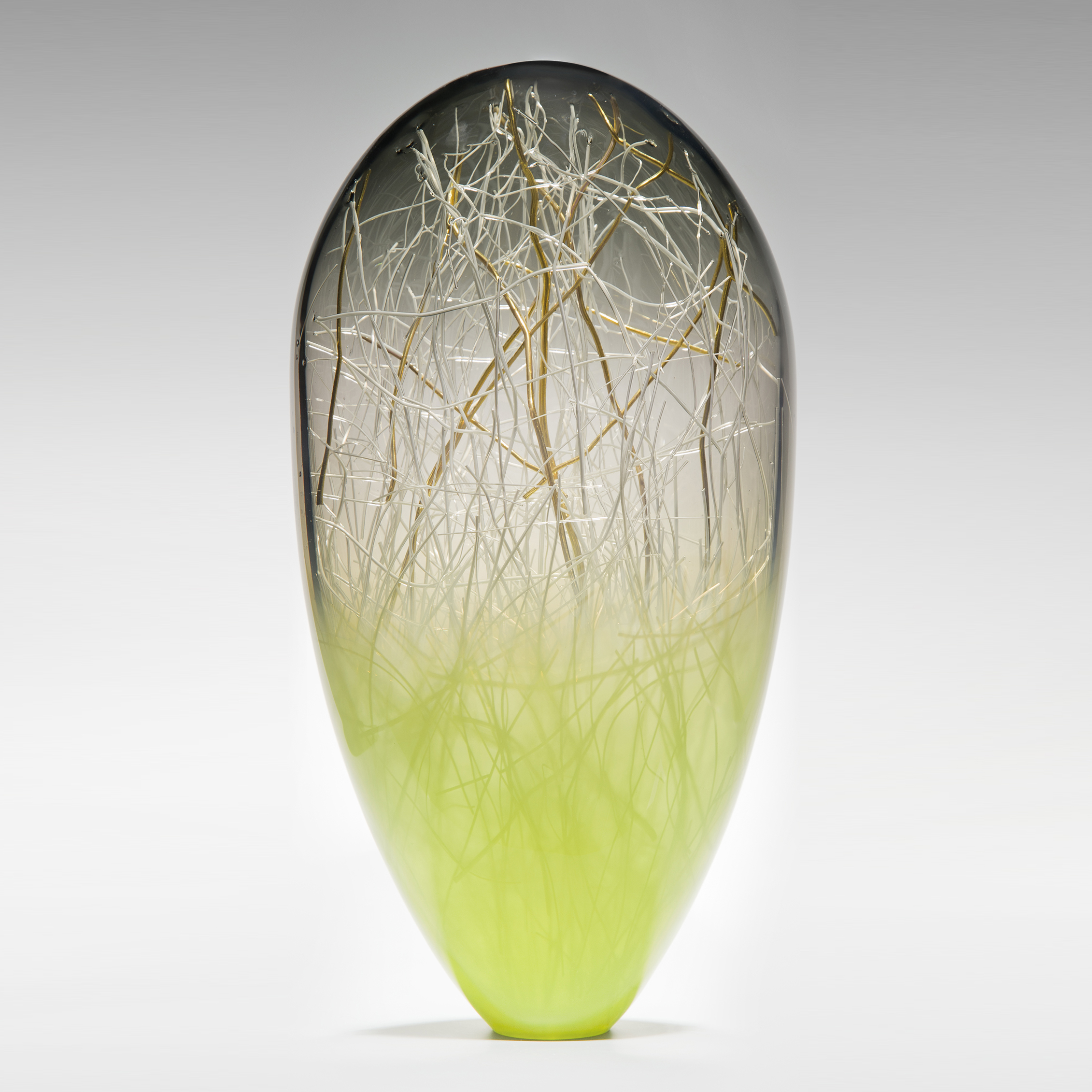 tall blown glass orb with internal gold wire structure and lime coloured base