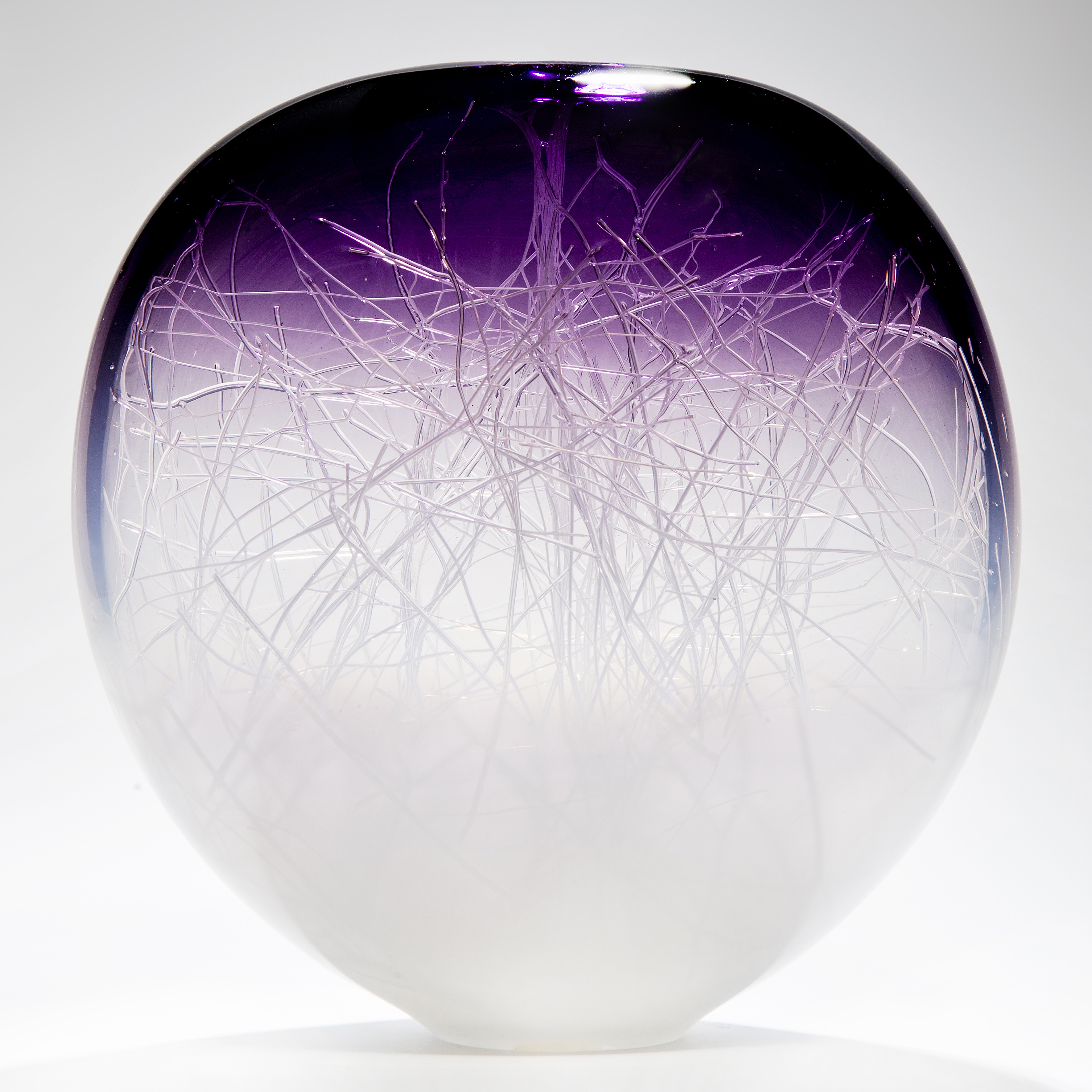 apple shaped art glass ornament in white with purple top