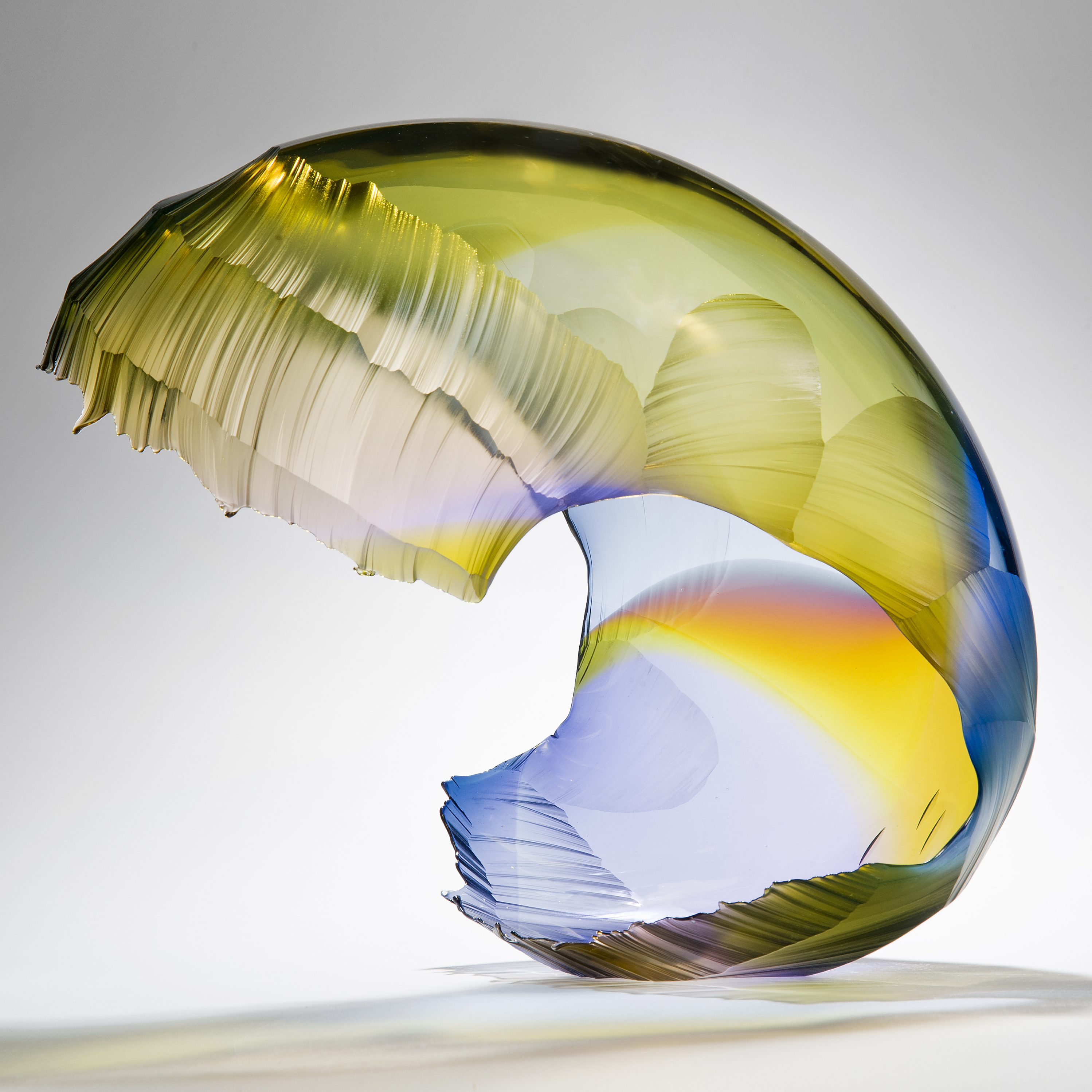 art glass wave sculpture in yellow and blue shades