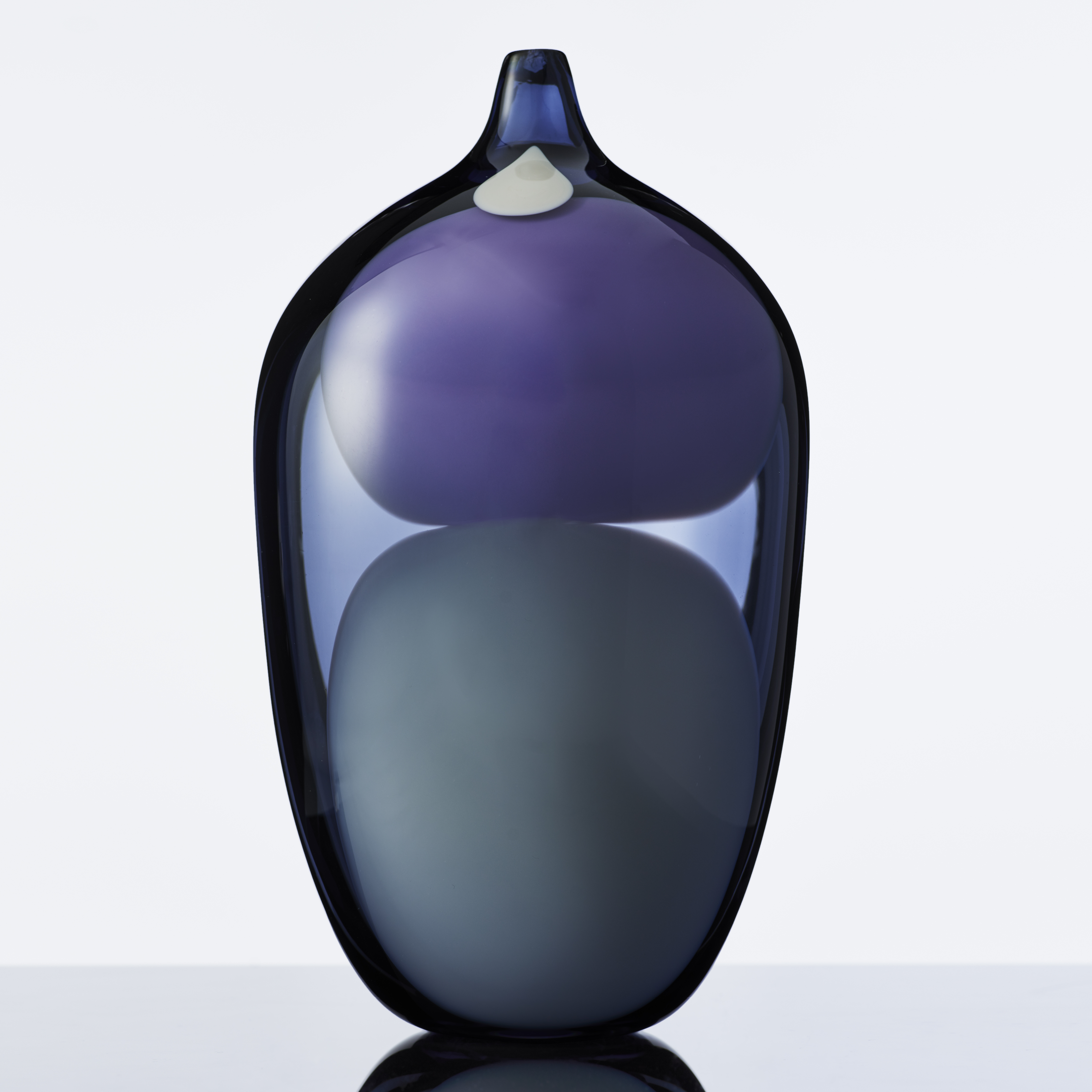 blown glass vase sculpture in shades of blue purple and grey