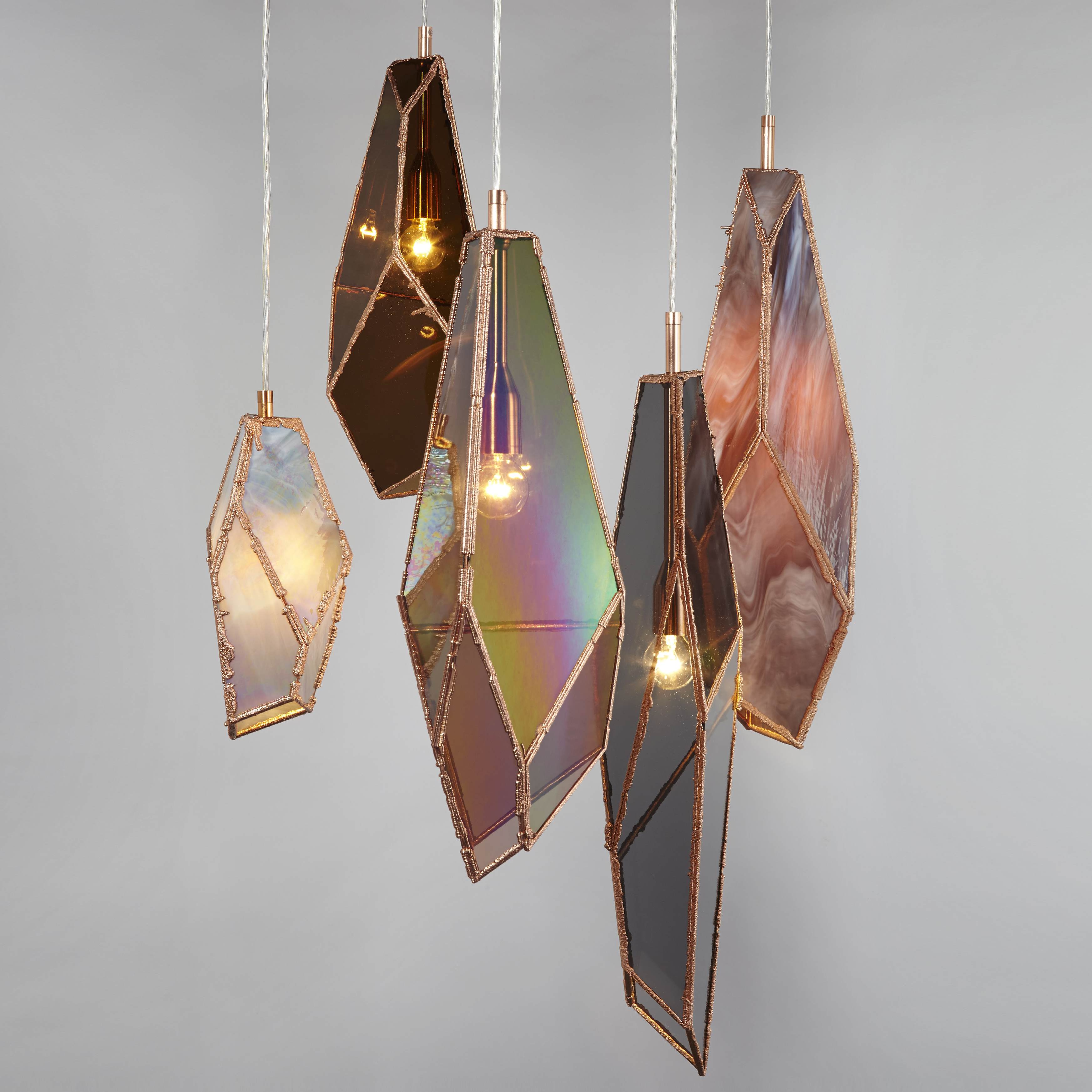 hanging pendant lights in bronze and rich coloured glass