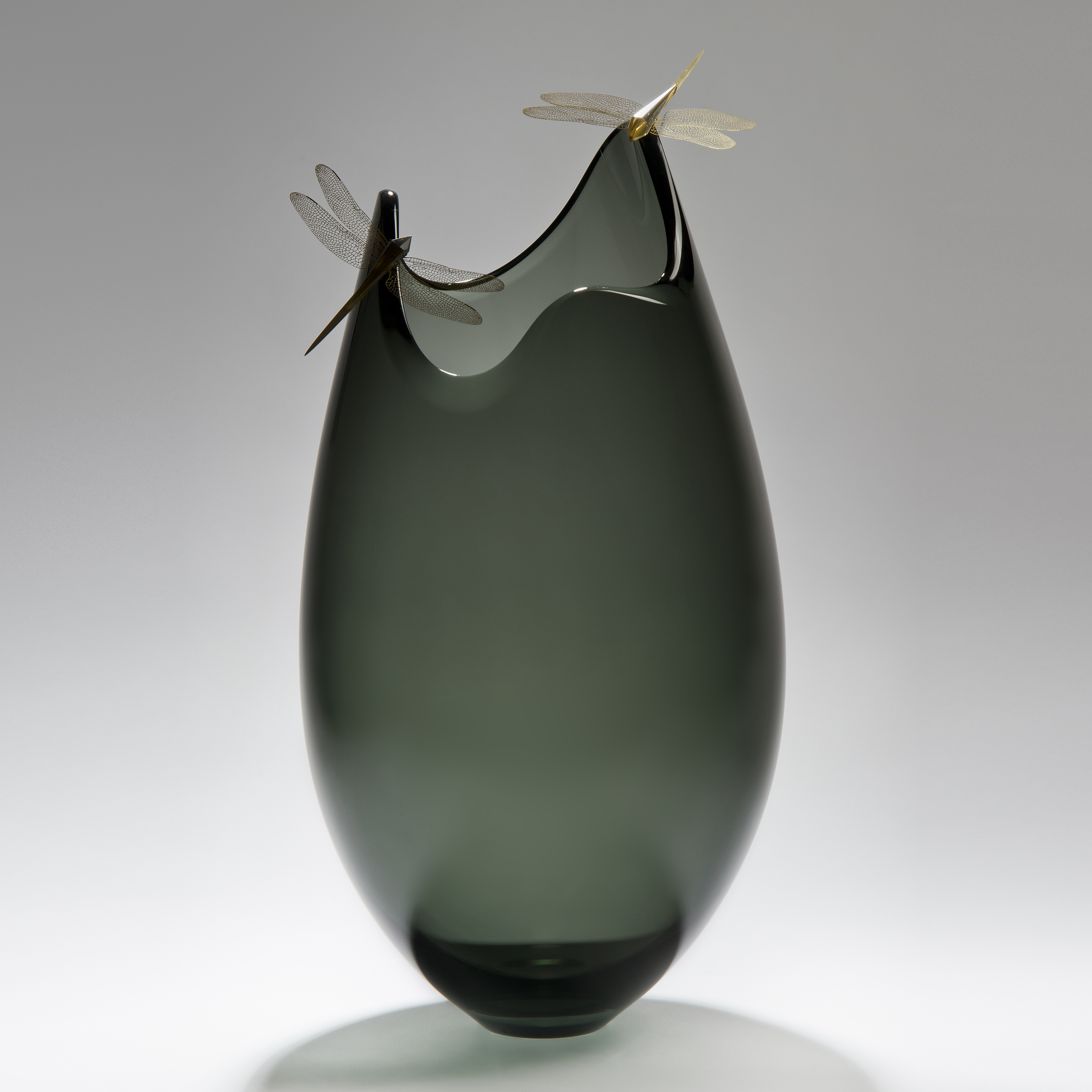 contemporary art glass sculpture of vase with assymetrical top adorned by two gold plated dragonflies