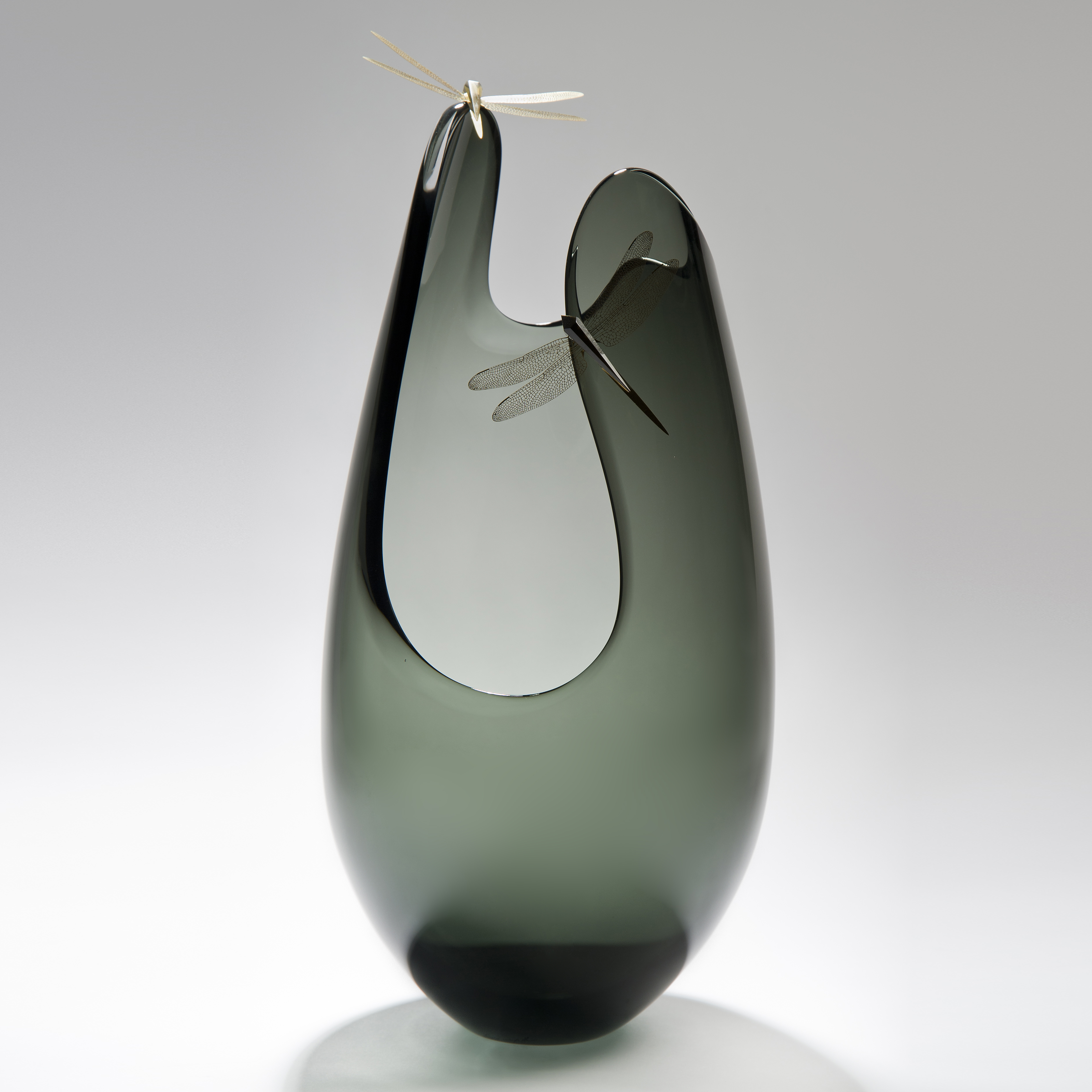 abstract tall grey art glass vase with wide open edges adorned with gold plated dragonflies