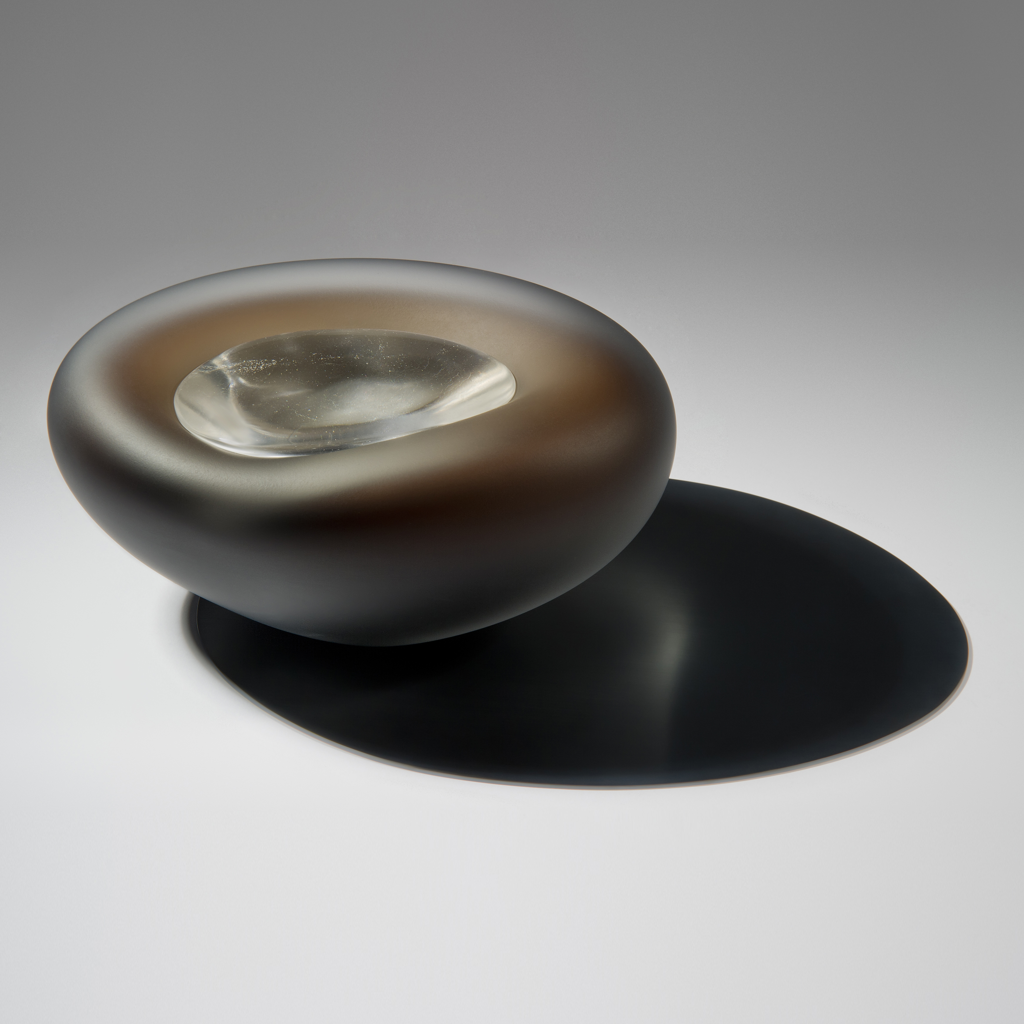 dark brown pebble shaped glass bowl with crystal like glass centre 