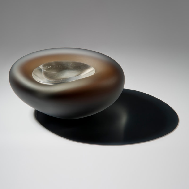 dark brown pebble shaped glass bowl with crystal like glass centre
