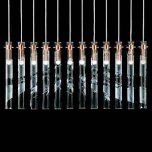 hanging blown glass lighting installation with metal fittings