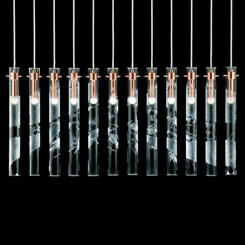 hanging blown glass lighting installation with metal fittings