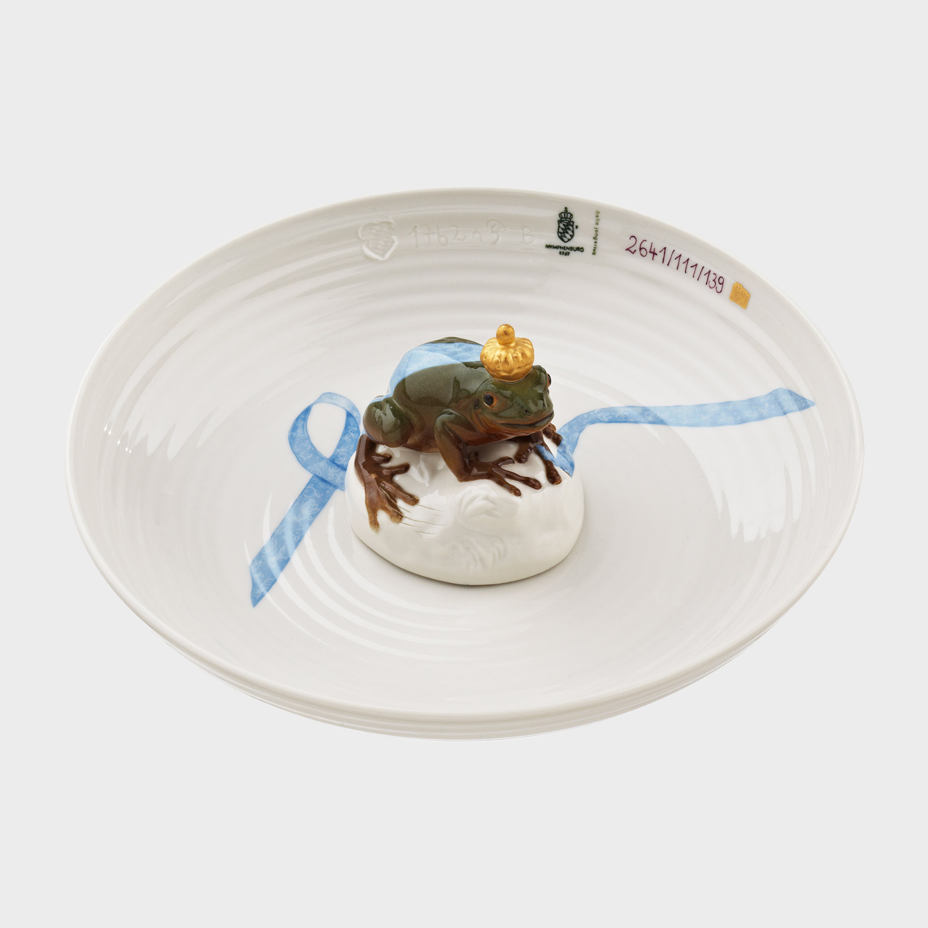 white porcelain art sculpture of bowl with miniature frog sat on top of item in the centre