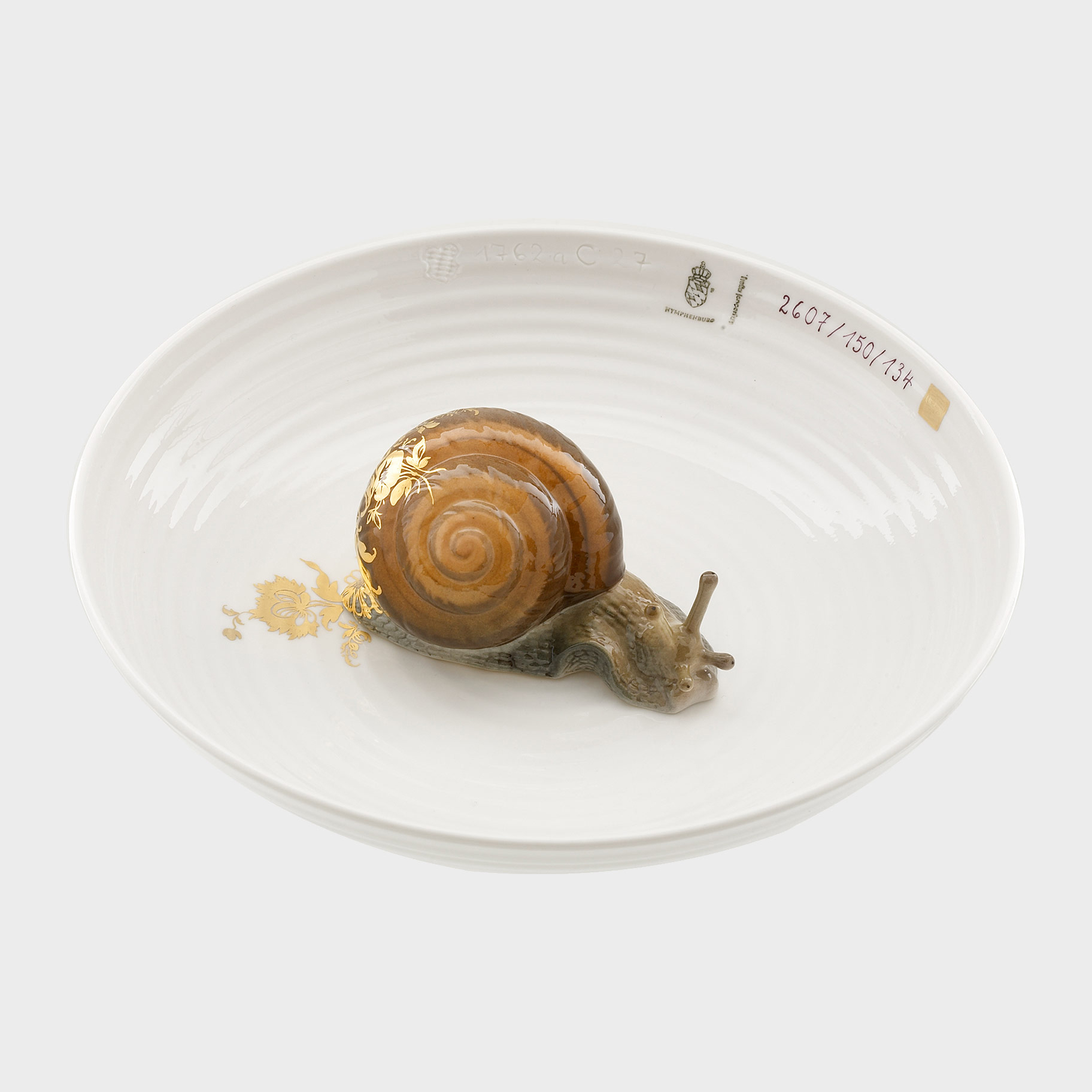 modern minature art sculpture with porcelain and snail 