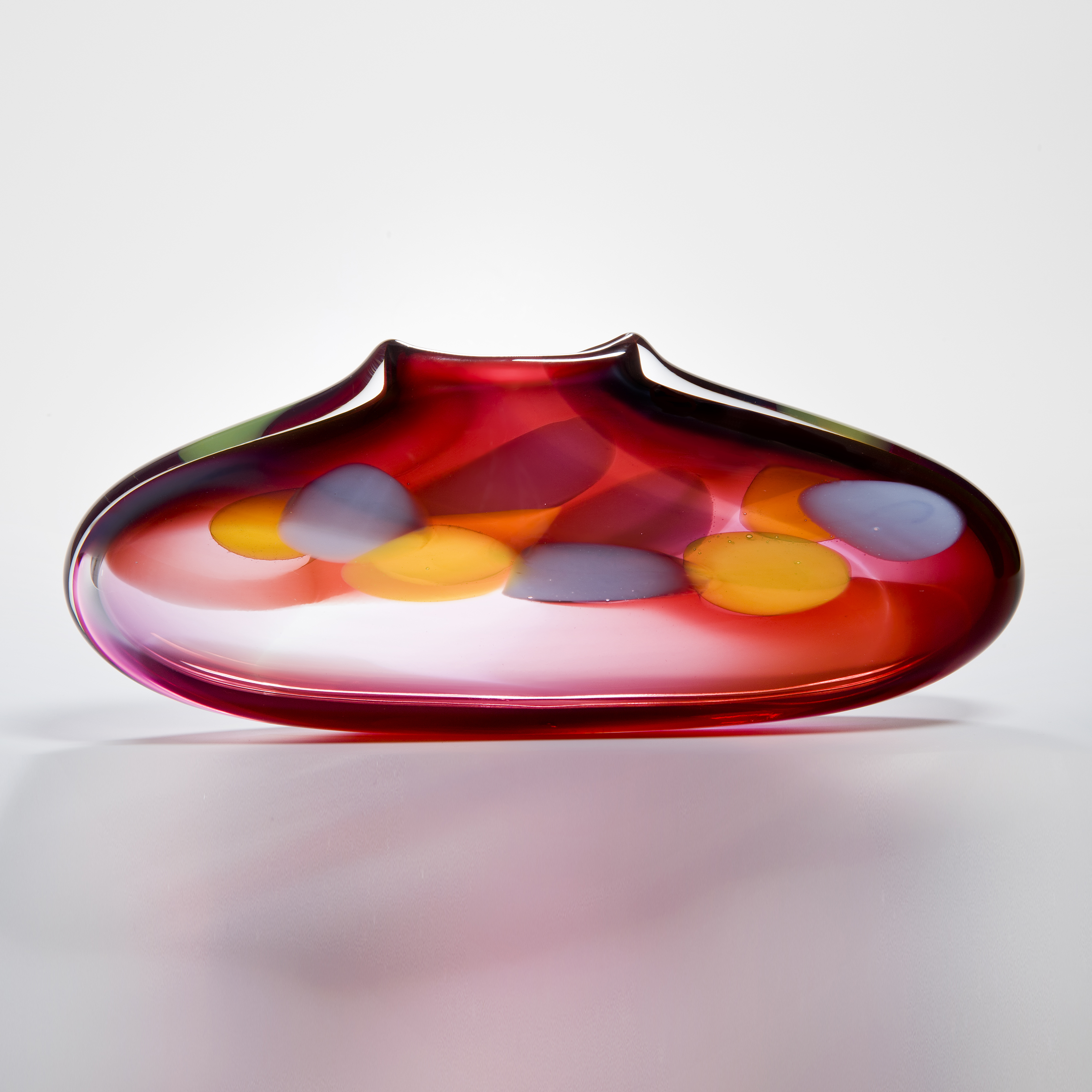 flat and abstract shaped purse vase in pink with grey and yellow splodges