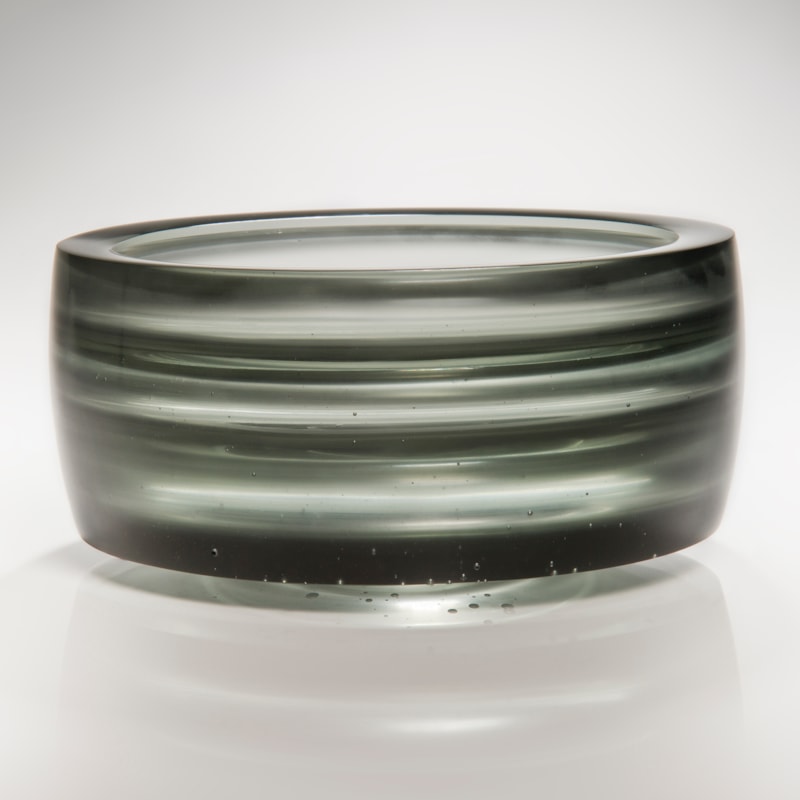 cast glass tyre-shaped sculpture in black and light grey