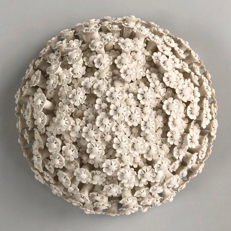 white porcelain art sculpture of daisies arranged in sphere