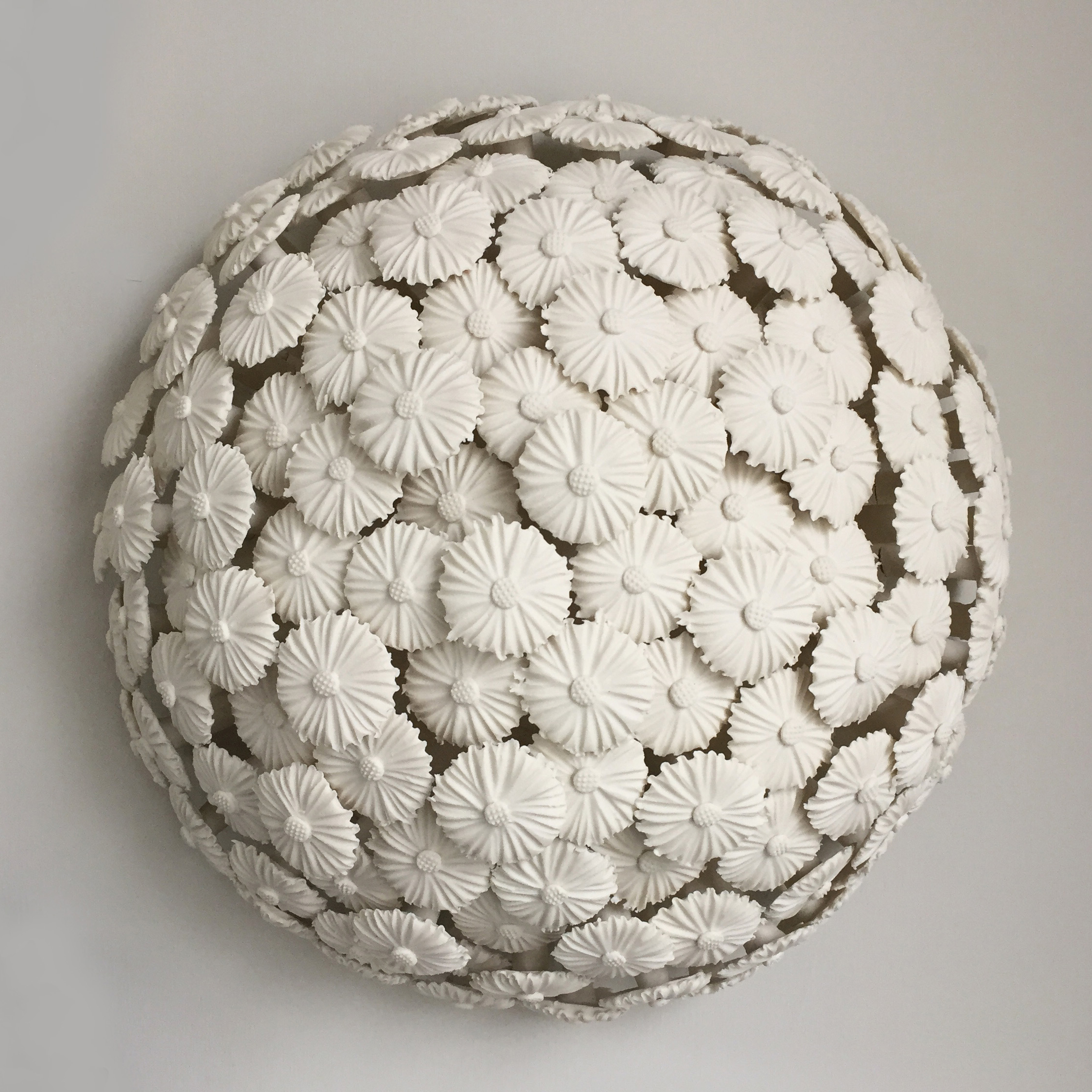 porcelain art sculpture of flowers arranged in sphere
