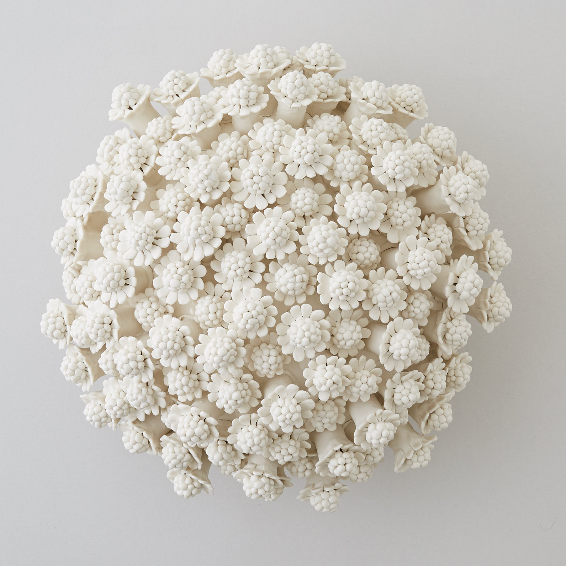 porcelain art sculpture of chamomile flowers arranged in sphere