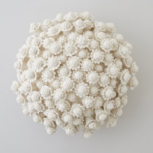porcelain art sculpture of chamomile flowers arranged in sphere