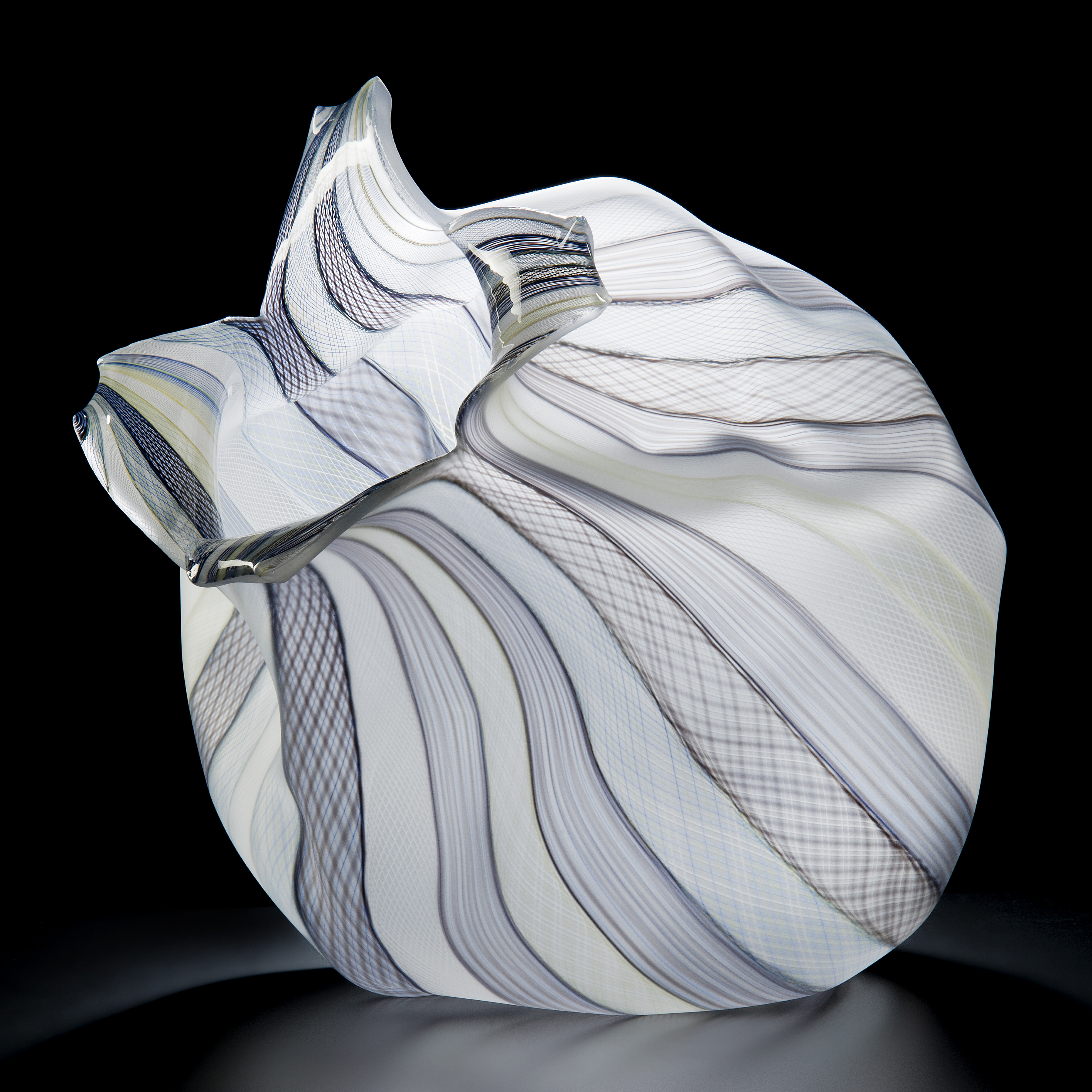 white cane freeblown glass sculpture of fruit with purple lined patterns