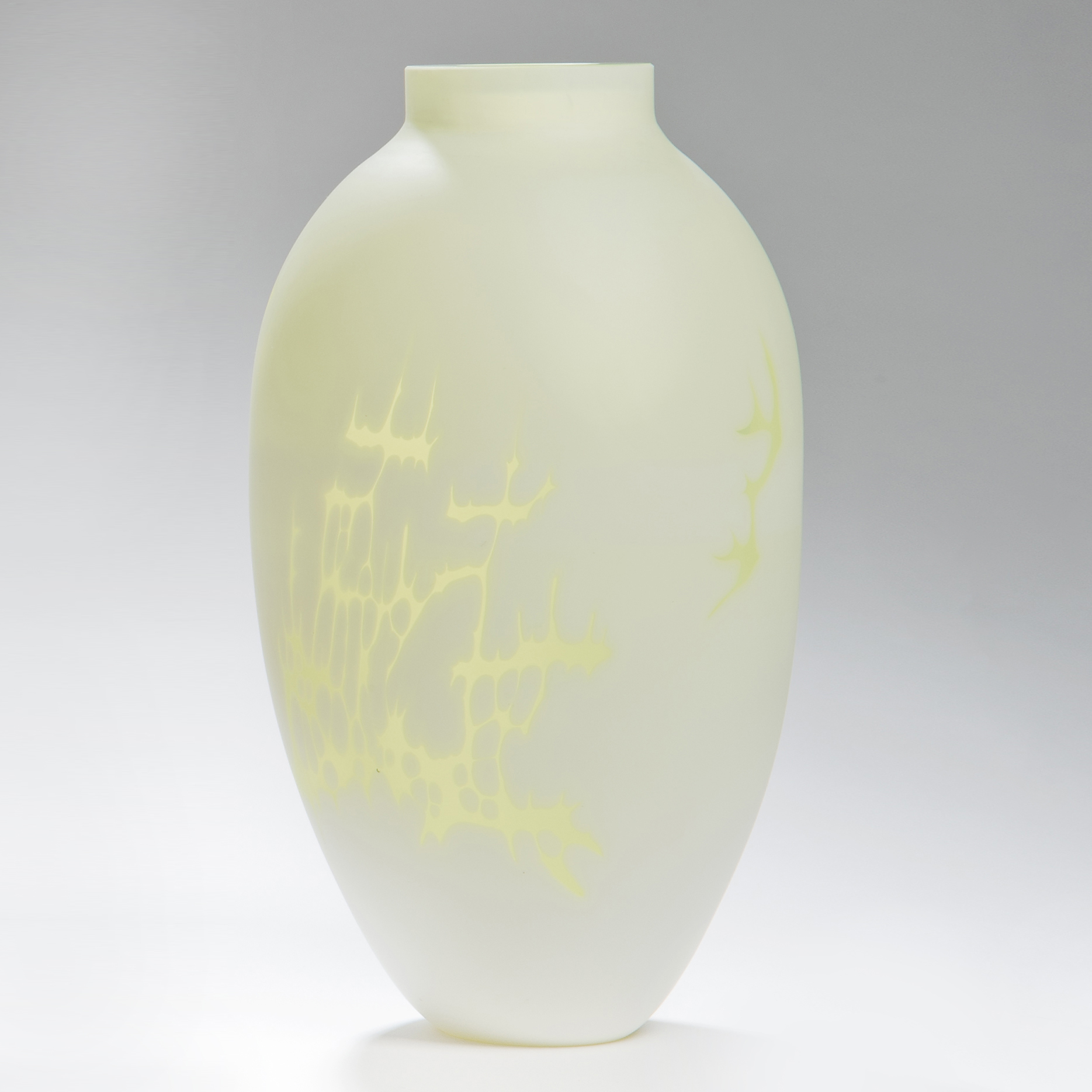 cameo art glass vase in white with yellow patterning