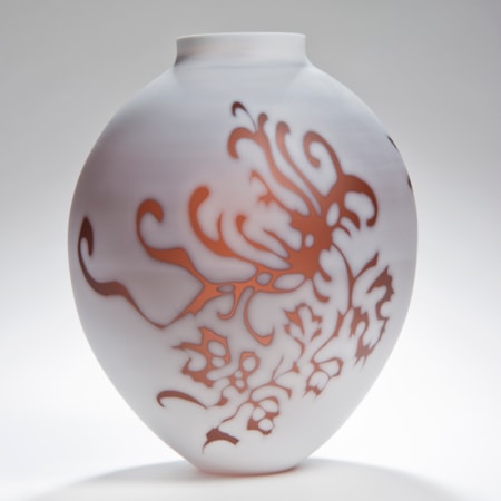 short round white cameo glass sculpture with orange floral motif