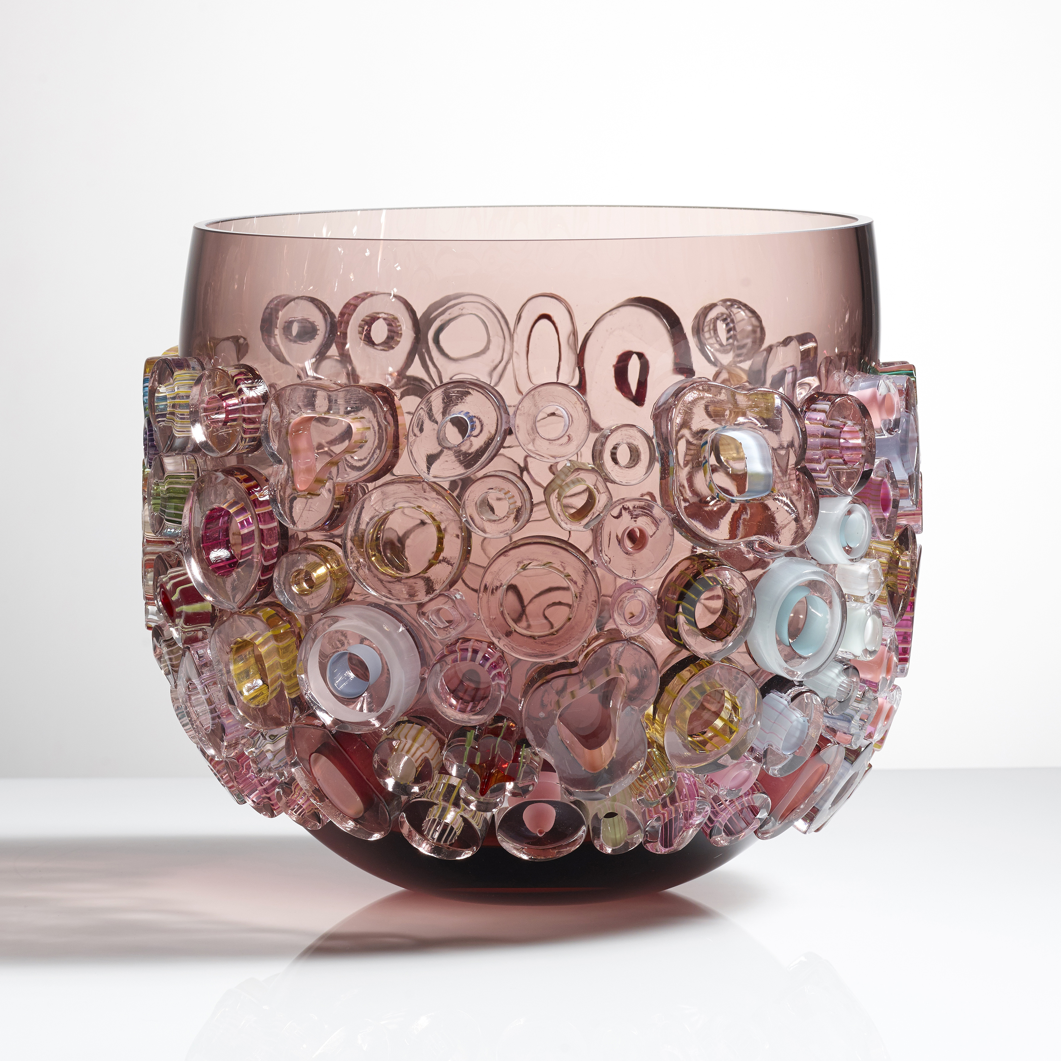 light brown glass vase sculpture with external lightly coloured donut shapes