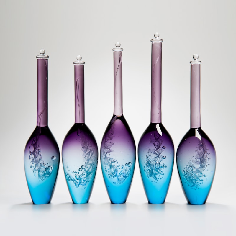 five handblown glass vase sculptures with long necks in pink purple and blue