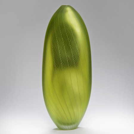 orb shaped art glass sculpture in yellow gold wth etched patterned exterior