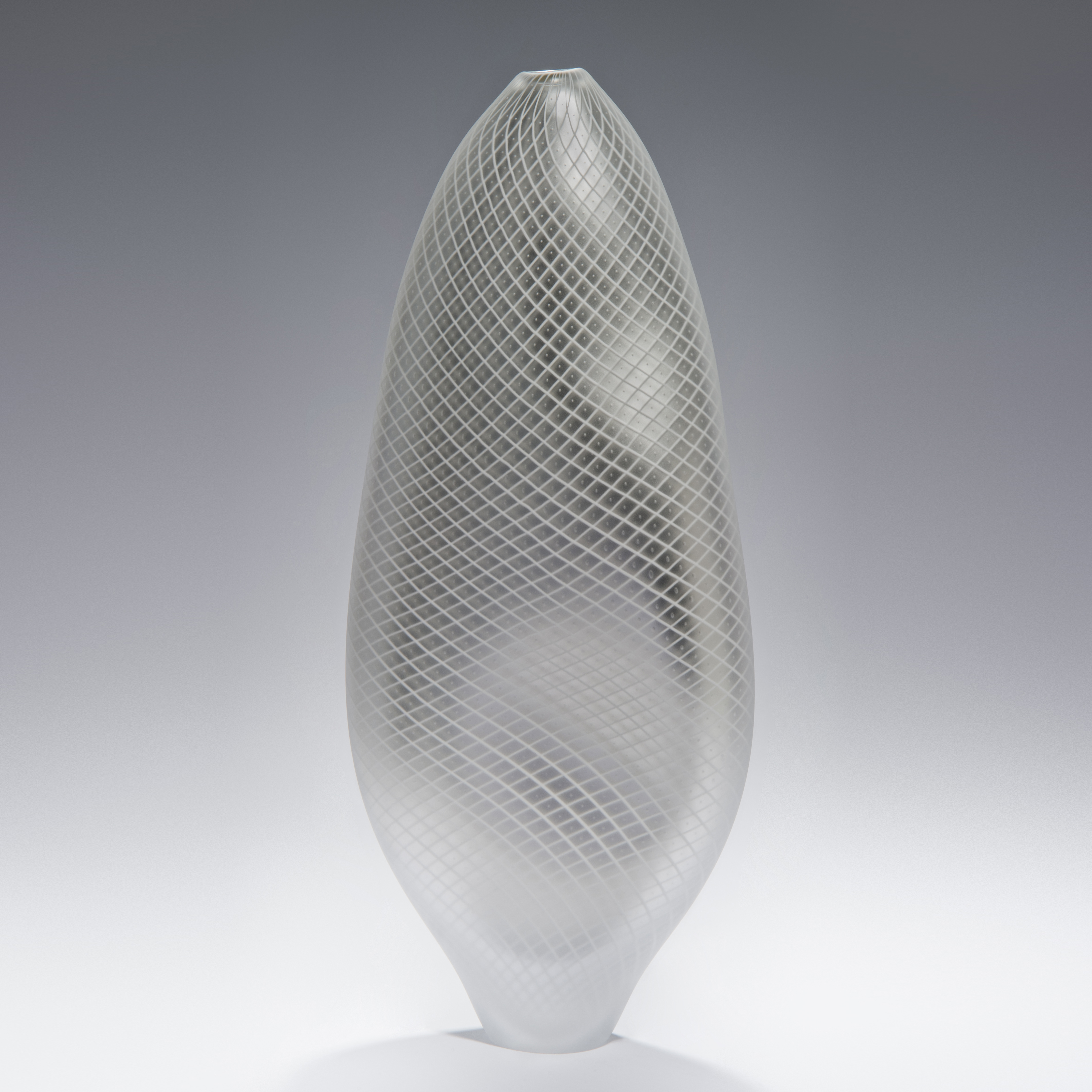 tall abstract blown glass vase in light grey with cross patterned exterior