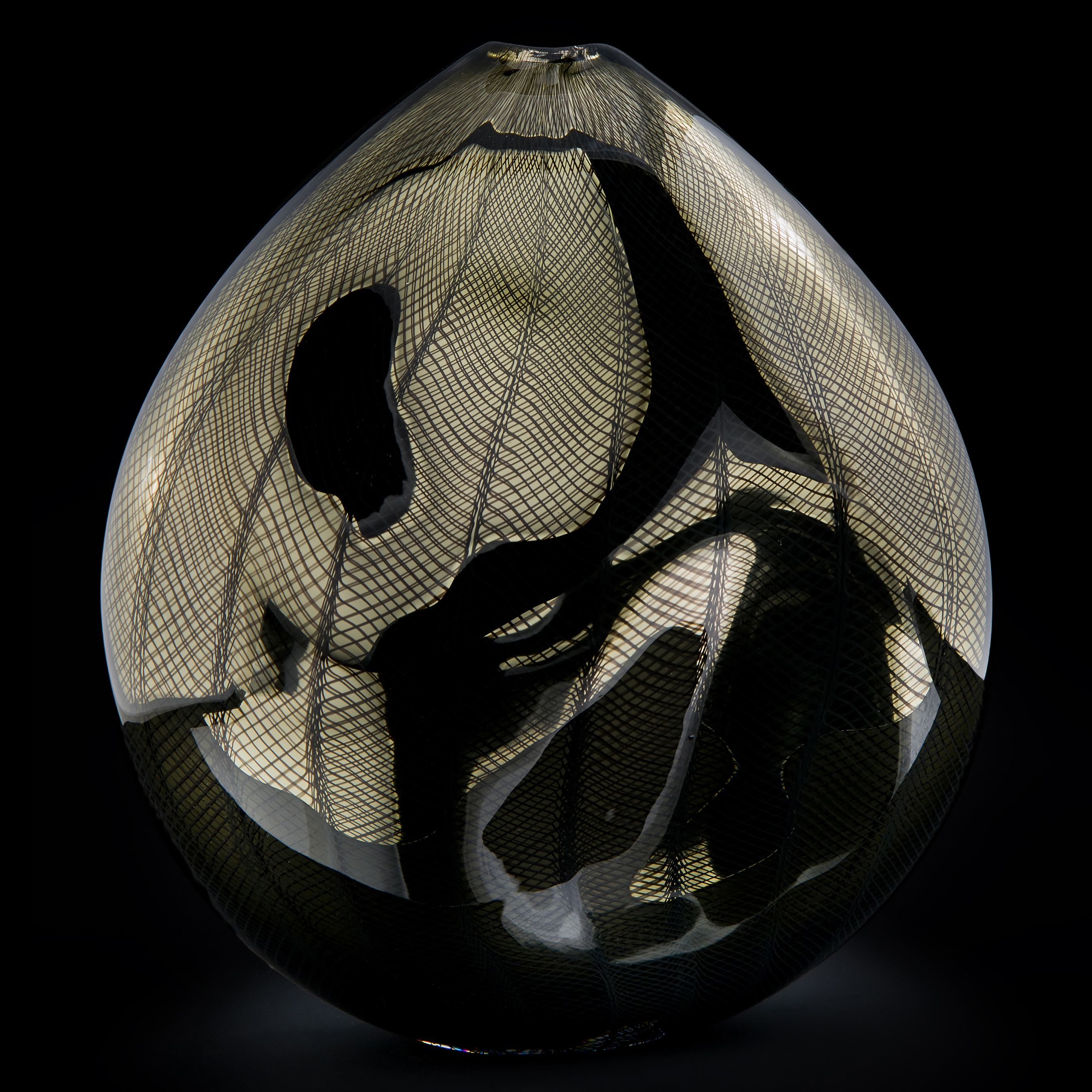 handblown minimalist glass teardrop shaped sculpted vessel in dark gold and black with wave checked external pattern