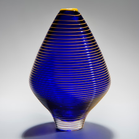 minimalist short electric blue glass  vase sculpture with faint yellow horizontal line pattern