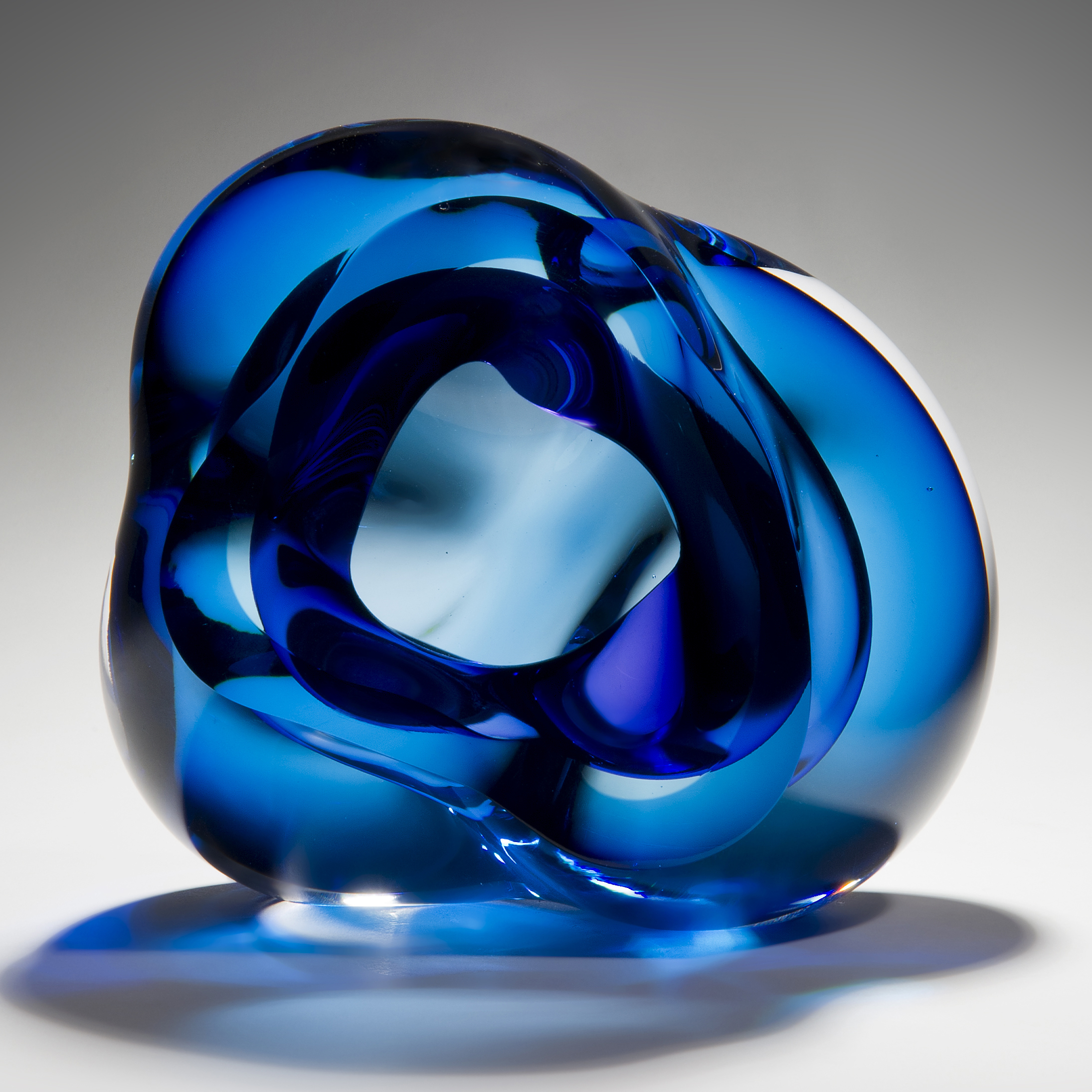 contemporary abstract art-glass sculpture of vug in light and dark blue