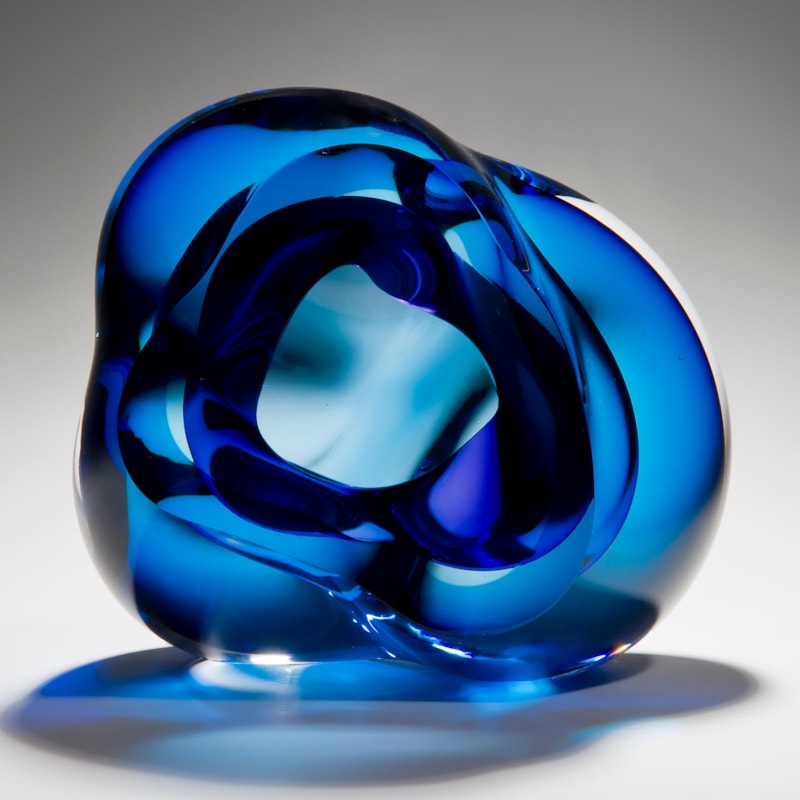 contemporary abstract art-glass sculpture of vug in light and dark blue