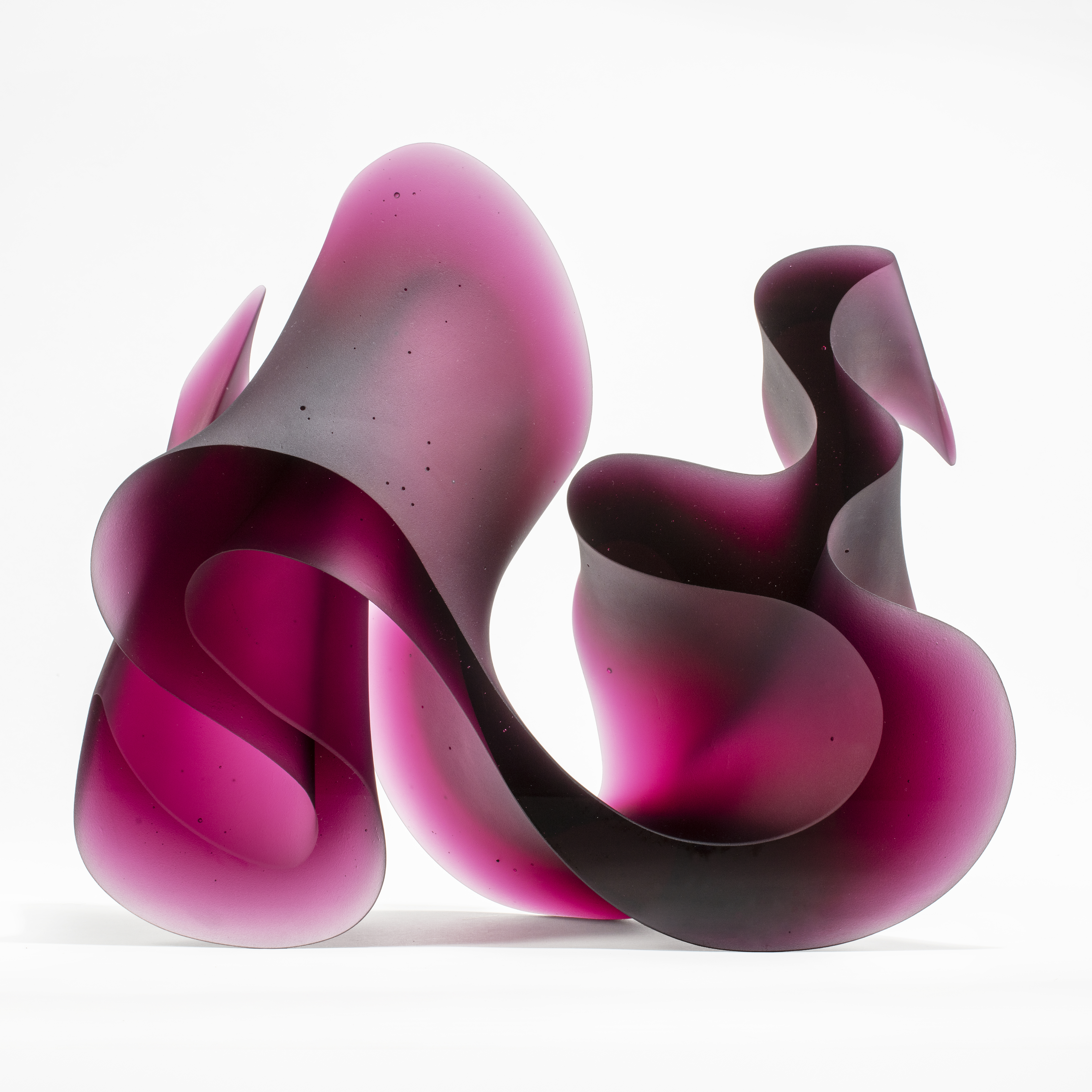 abstract geometric contemporary glass sculpture of squiggle in pink and black
