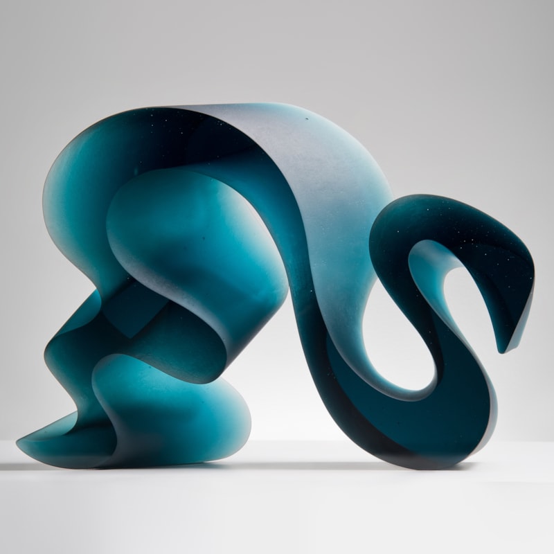 abstract contemporary glass art sculpture of a squiggly line in jade