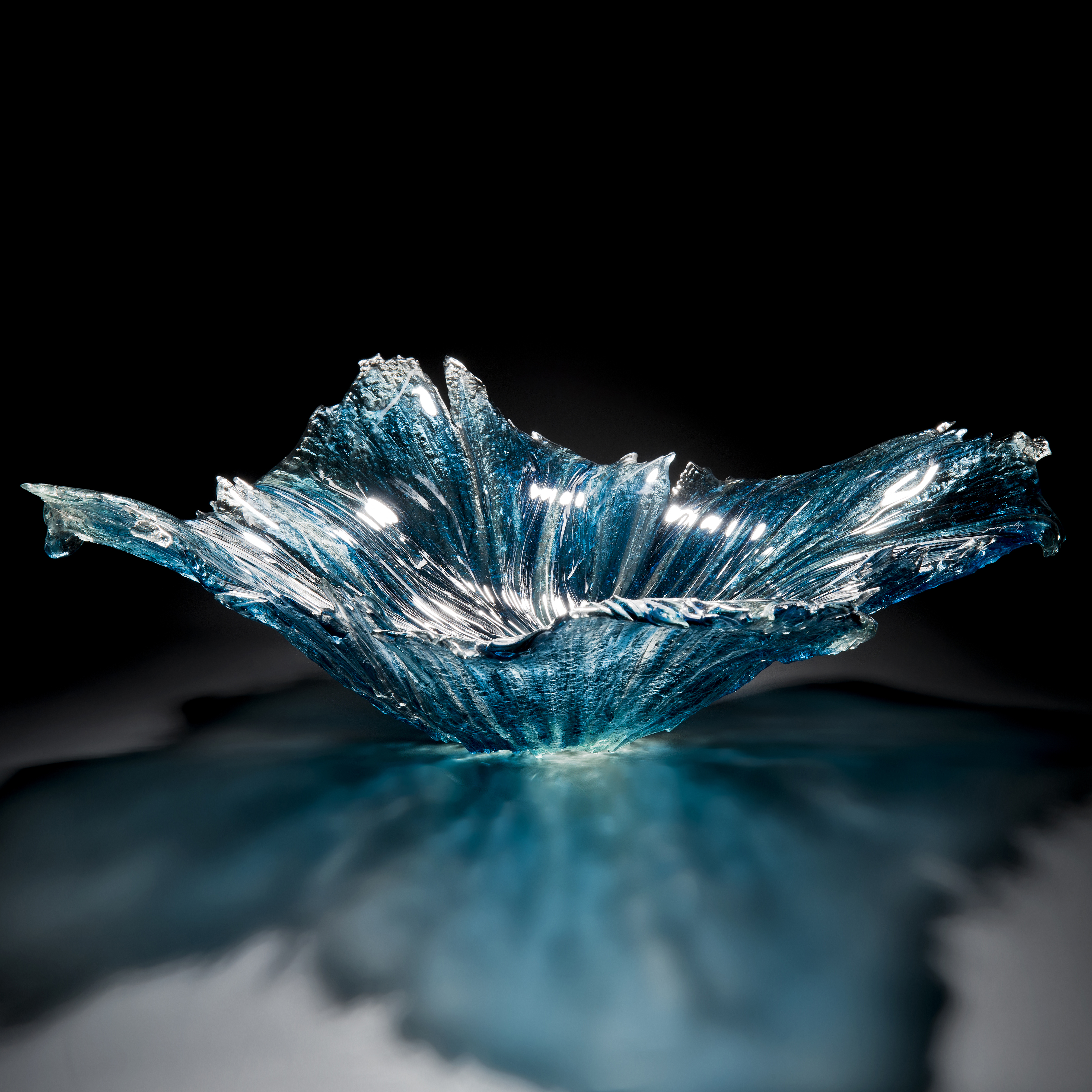 aqua art-glass bowl sculpture with protruding edges