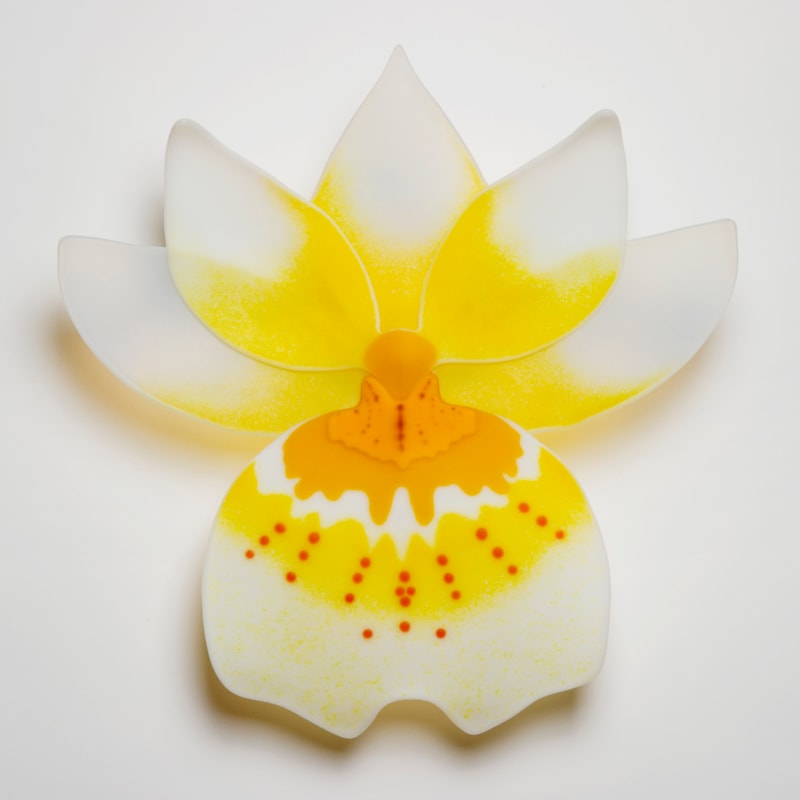glass sculpture of pansy flower in yellow and white