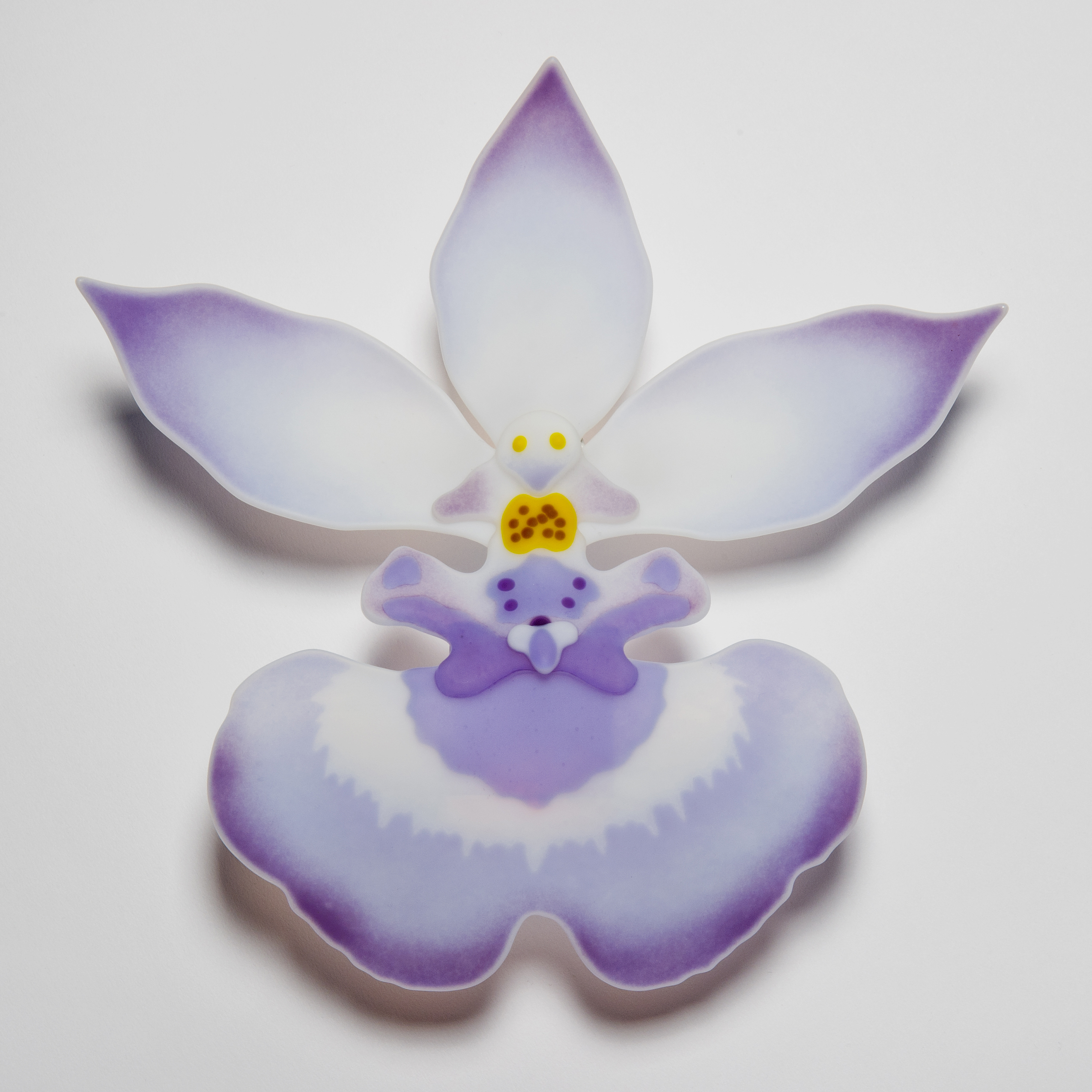 glass art sculpture of exotic flower in white and mauve