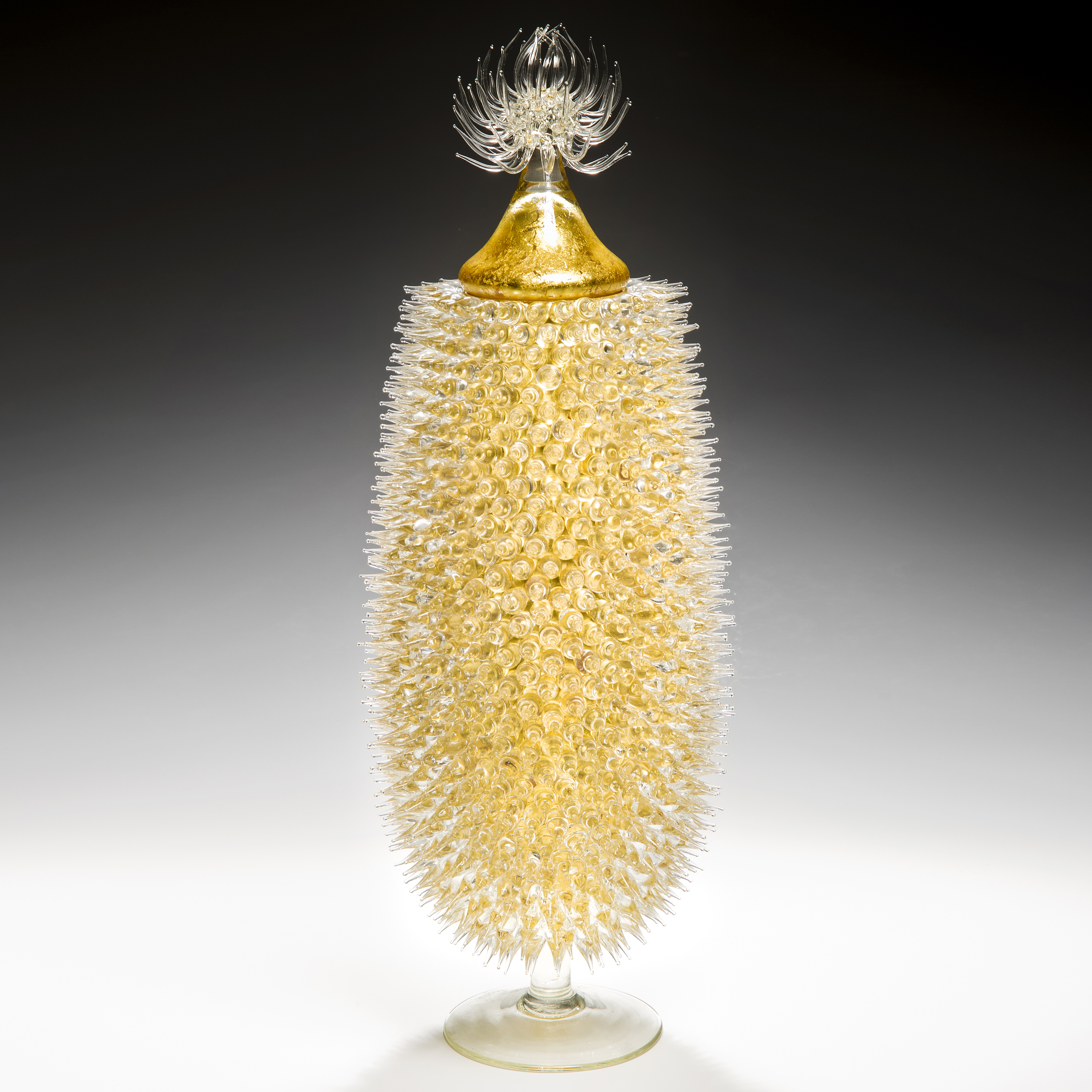 tall art-glass jar in yellow and gold with thistle shaped centre