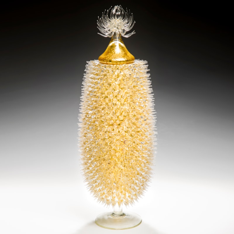 tall art-glass jar in yellow and gold with thistle shaped centre