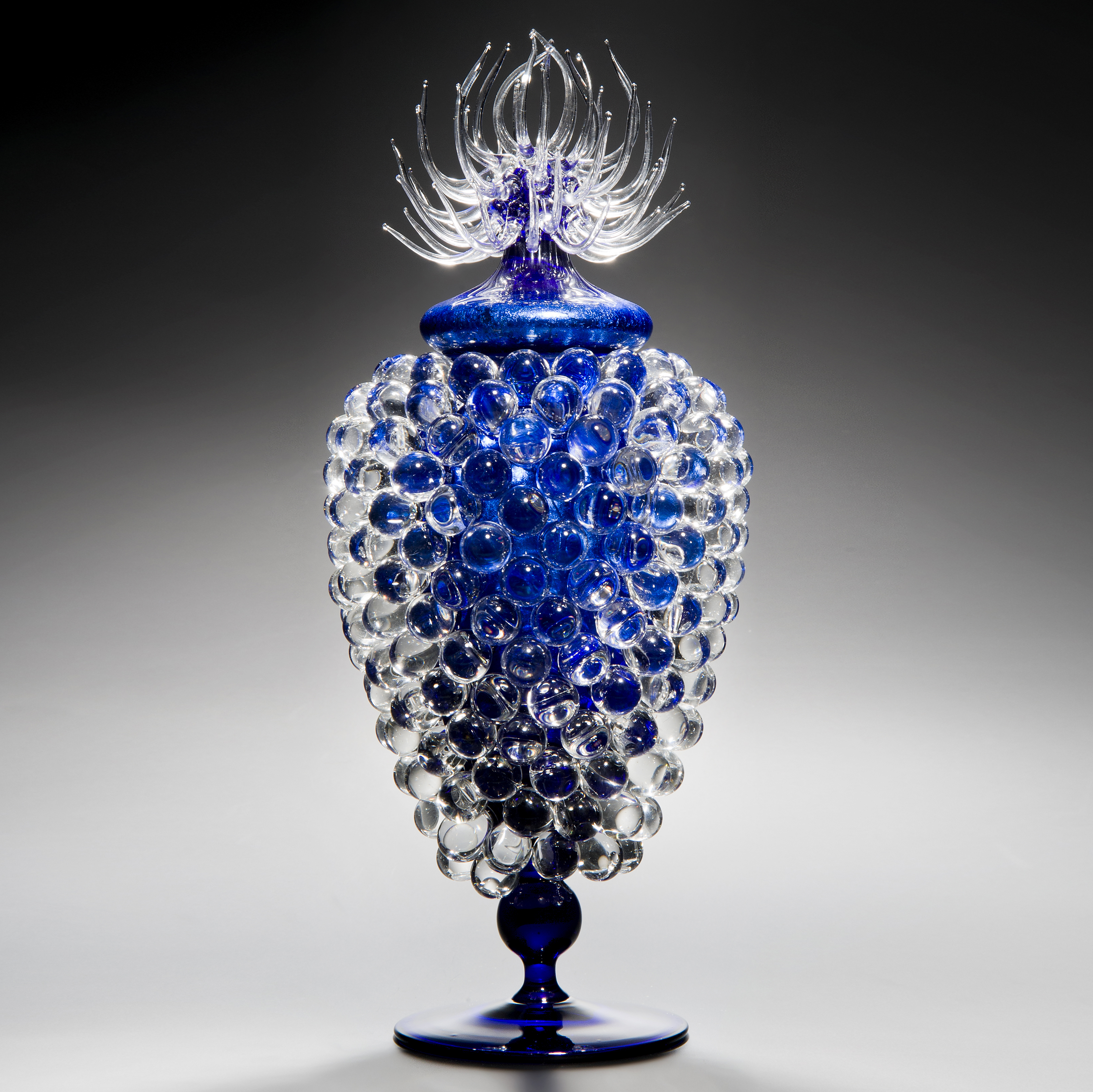 art glass jar sculpture with long base and thistle top