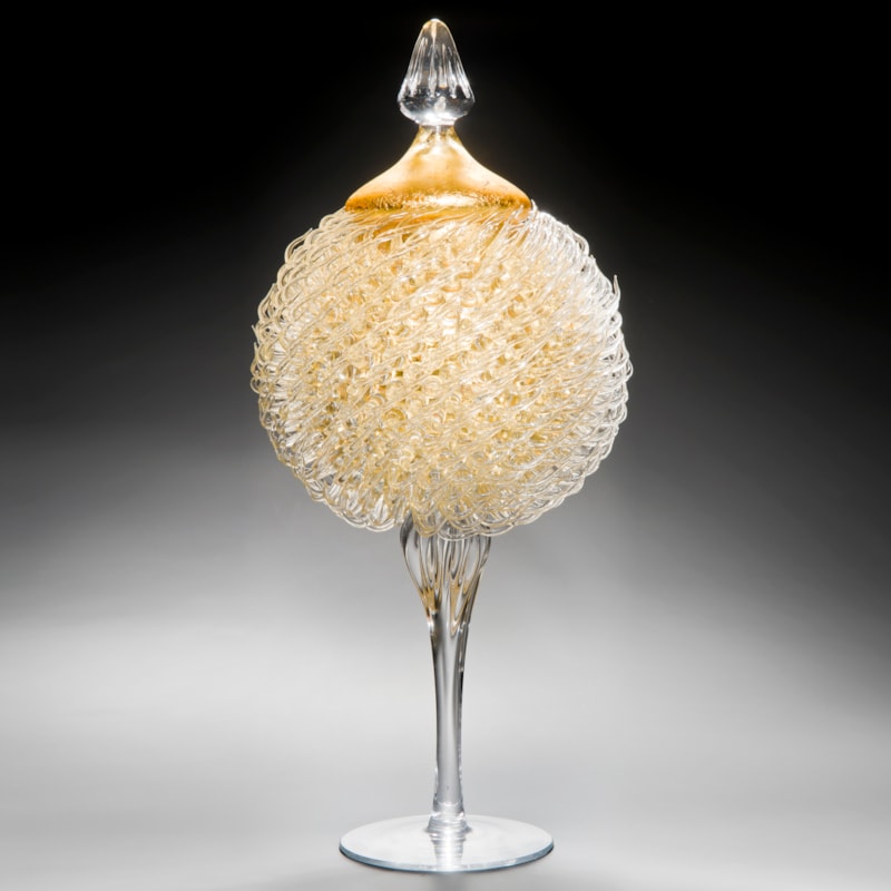 tall art glass jar sculpture with long base and gold thistle body