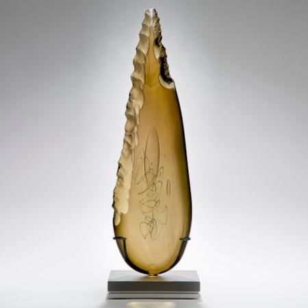 bronze leaf shaped art glass sculpture on grey base