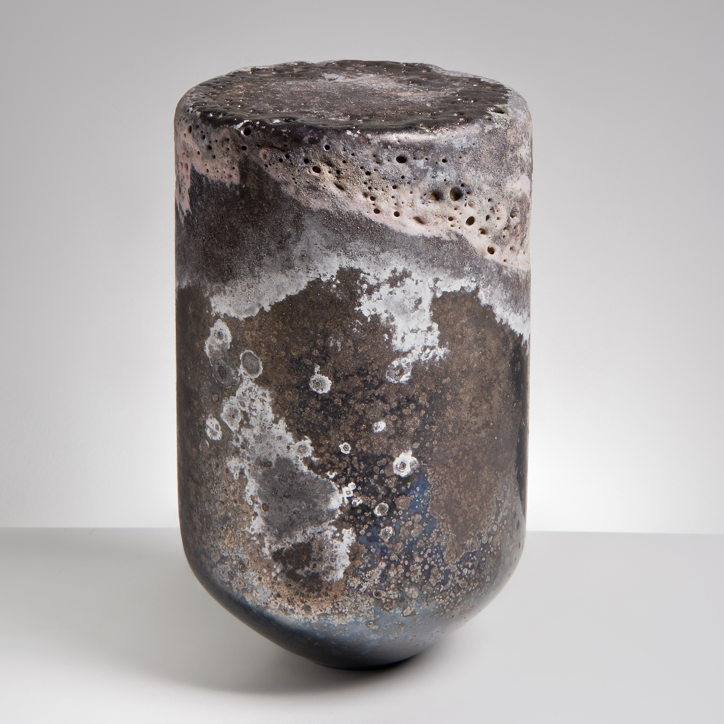 glass art sculpture made to look like natural stone in the shape of a bullet