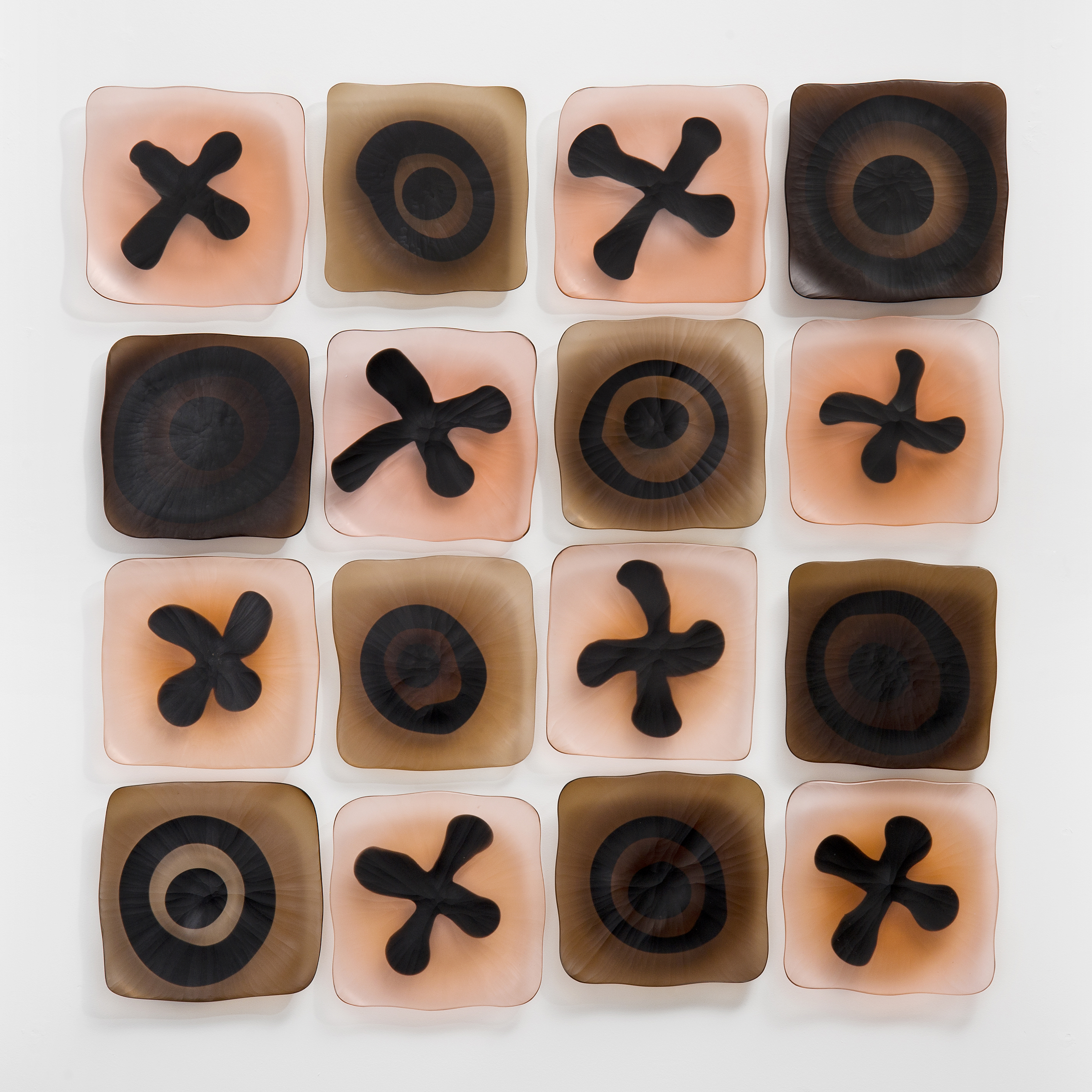 wall-mounted glass art sculpture resembling chocolate box in white brown and rose pink