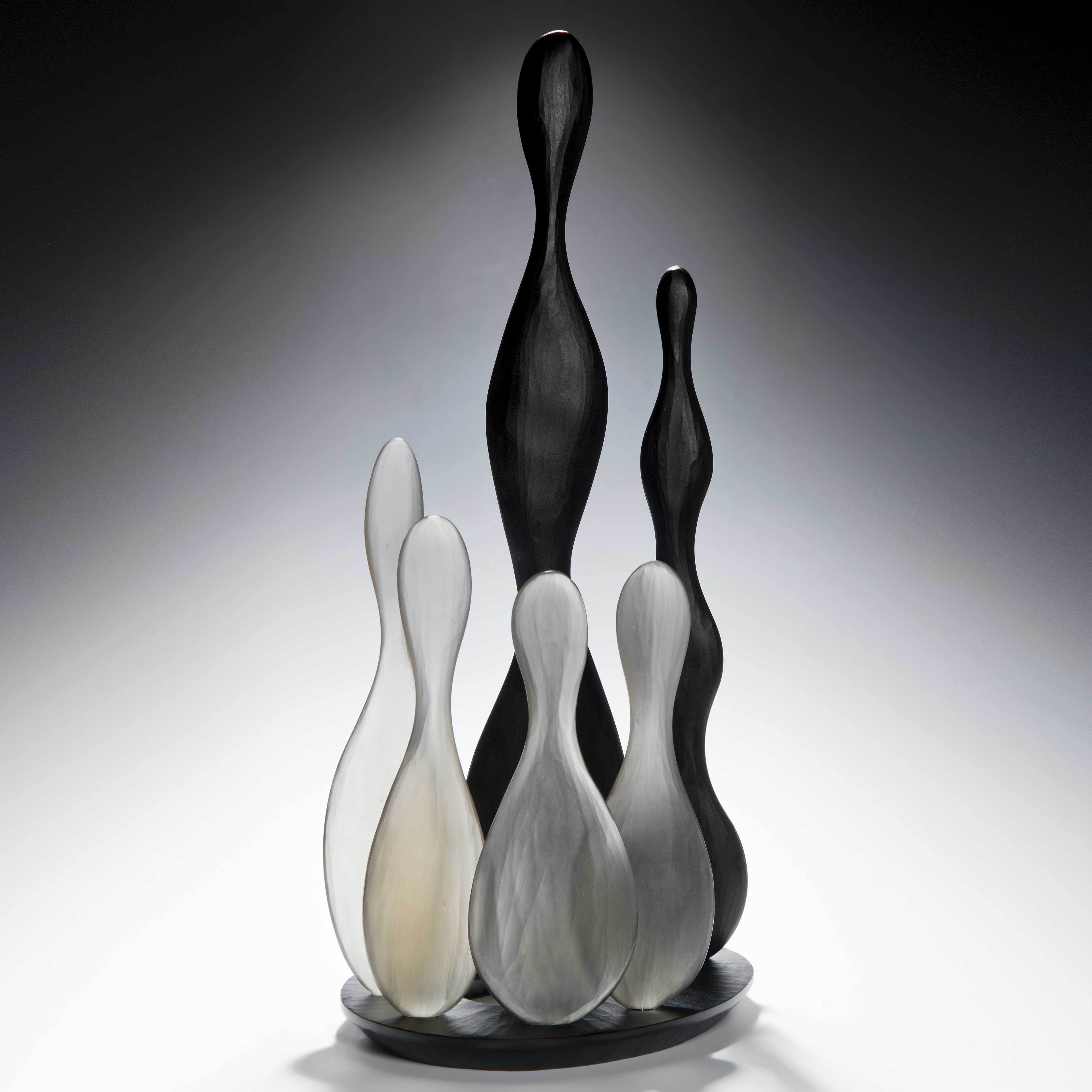 still life art glass skittles in black and white glass on black base